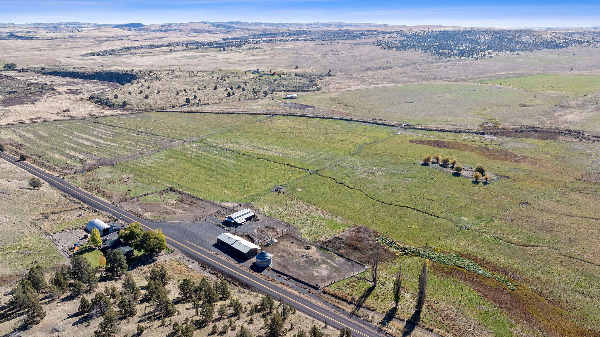 Nestled in Oregon's high desert near Antelope, K Kross Ranch spans 1,555± acres with 252± acres of irrigation rights supplied by wells. Water is delivered by pivot, wheel line, and pod systems for efficient hay and pasture production. The ranch includes a 3-bed, 2-bath home, metal shop, hay shed, and a 6-stall horse barn with bunkhouse. Additional facilities include a livestock barn, cattle working pens, feedlot, corrals, and outdoor arena.

Frontage along Antelope Creek adds beauty and habitat value. The property is fenced and cross-fenced with livestock water systems and NRCS program participation offering potential income. Excellent hunting for elk, mule deer, and aoudad sheep with LOP tags available. Sweeping Cascade Mountain views complete this exceptional working and recreational ranch.