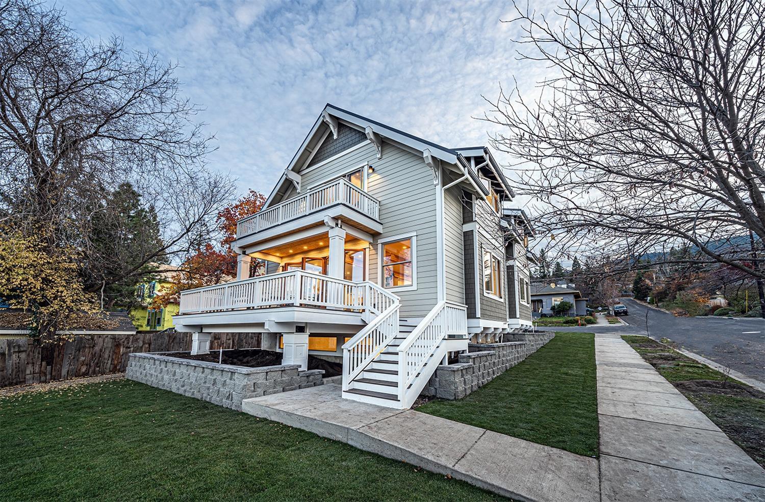 Award-winning historically compatible new construction in the enchanting Siskiyou-Hargadine District, just over a flat half-mile of Ashland's downtown plaza! Renowned local builders at Coleman Creek Construction and architect Mark Holsman achieved a modern northwest aesthetic with exposed timber trusses, dramatic folding glass door NanaWall, matte black metal fixtures, leathered granite, hickory flooring, solid core doors, smooth interior plaster, gas fireplaces, and abundant natural light from Velux skylights and Jeld-Wen casement windows. Kitchen equipped with stainless appliances, under-mount farmhouse sink, and walk-in pantry. Bathrooms outfitted with soaking tubs, frameless glass showers with curbless entries, and Dyconn LED mirrors. Bedrooms have views of the Siskiyou and Cascade mountains, dual closets, and dormer skylights to sleep under the stars. Exterior features a metal roof, composite decks and balcony. Plans for guest home (ADU) approved by City of Ashland on file.