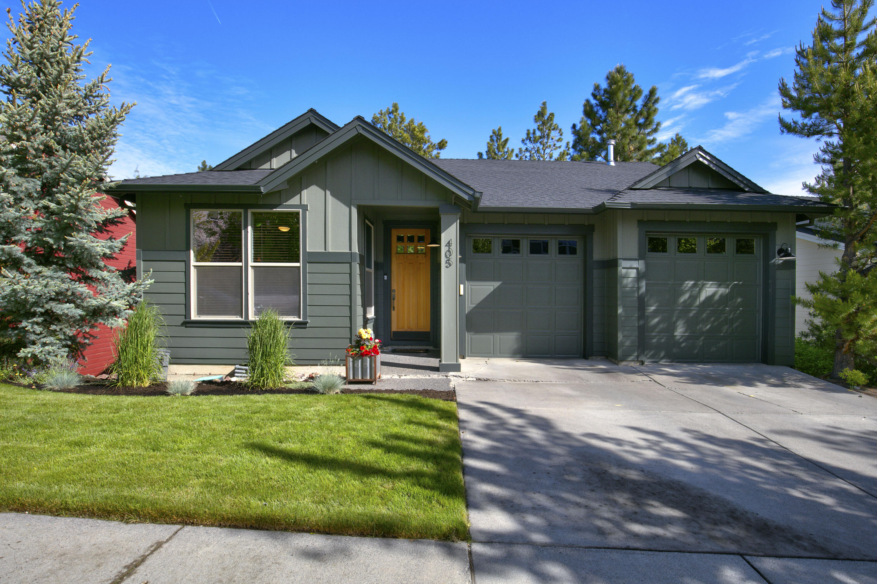 Spacious updated home nestled in the heart of Bend's Westside. Just steps from your front door enjoy mountain biking/hiking trails, shopping & dining, Discovery Park & more! The open concept floor plan lives large with tall ceilings, expansive living areas & abundant natural light throughout. Main-level living features a large updated kitchen, high-end appliances, a great room with lovely views of large Ponderosa Pines & a luxurious main-level primary suite with access to outside covered deck, dual vanities, walk-in closet & stylish dual-headed tile shower. On the lower level you will find a second primary suite with gas fireplace, family room with gas fireplace, office or guest ensuite, wet bar with dishwasher & wine fridge, second laundry area, large deck & separate entrance. Entertaining is easy as the sliding glass doors seamlessly integrate the indoor & outdoor living areas. Kick back & relax in the quiet, fully-fenced backyard with mature Ponderosa Pines, garden & fire pit.