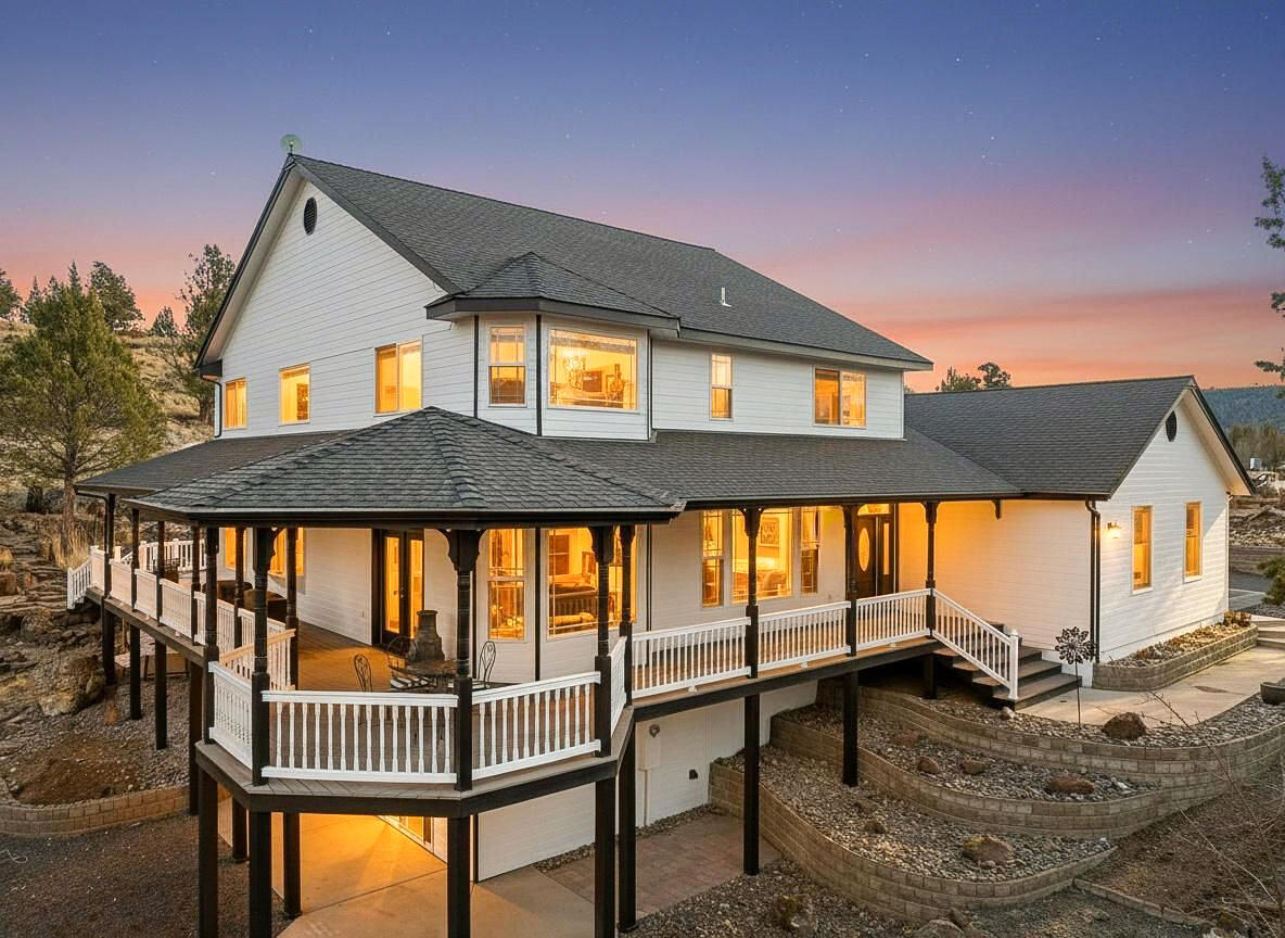 Stunning home sitting on 1.10 acres in Sunset Hills neighborhood. Unique multi-generational living opportunity, plus a shop! Greeted by the large wrap around deck, walk into this home featuring 4,498 sqft, 3 bed, 3.5 bath, vaulted ceilings and tons of natural light. Large Kitchen with walk-in pantry. Family Room with cathedral windows, cozy fireplace and access to the back deck with calming pond and water feature. Spacious Primary Bedroom on the main floor with walk-in closet, large bathroom featuring jetted soaking tub and tiled shower. 2 bedrooms, full bath, loft/office upstairs. Downstairs from main level is a fully finished basement with full kitchen, 2 rooms, full bath and living room space.  Private exterior entrance and can be closed off from the main house. New exterior paint, wrap around driveway with new asphalt, new true 2 car garage door to the main home. Nice size shop with loft/workspace area on the 2nd level. All you could ever want and more is right here!