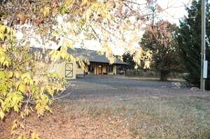 Please come see this comfortable, well-built 2 bedroom 1 office and 2 bath ranch style home. It is located on 2.75 acres in a rural area of Shady Cove/Eagle Point.

It offers French doors that open off the kitchen to a sun porch that includes an operating wood burning cook stove and is plumbed for a sink. Master bedroom/bathroom suite includes indoor jacuzzi room with shower (you bring the jacuzzi) Heat pump & two water heaters assist with any comfort needs for a large family. 

The attic area is great for storage.R49 insulation is in ceiling & Interior walls are insulated. 

Located directly next door on this property is a 3 room office with kitchenette & attached single car garage. Behind is fenced garden area.

Please take time to visit all the advantages of this ideal rural setting. Did I mention that there is an enclosed shop and roomy covered enclosures for RVs or other toys? You are only a couple miles from Shady Cove & Rogue River.