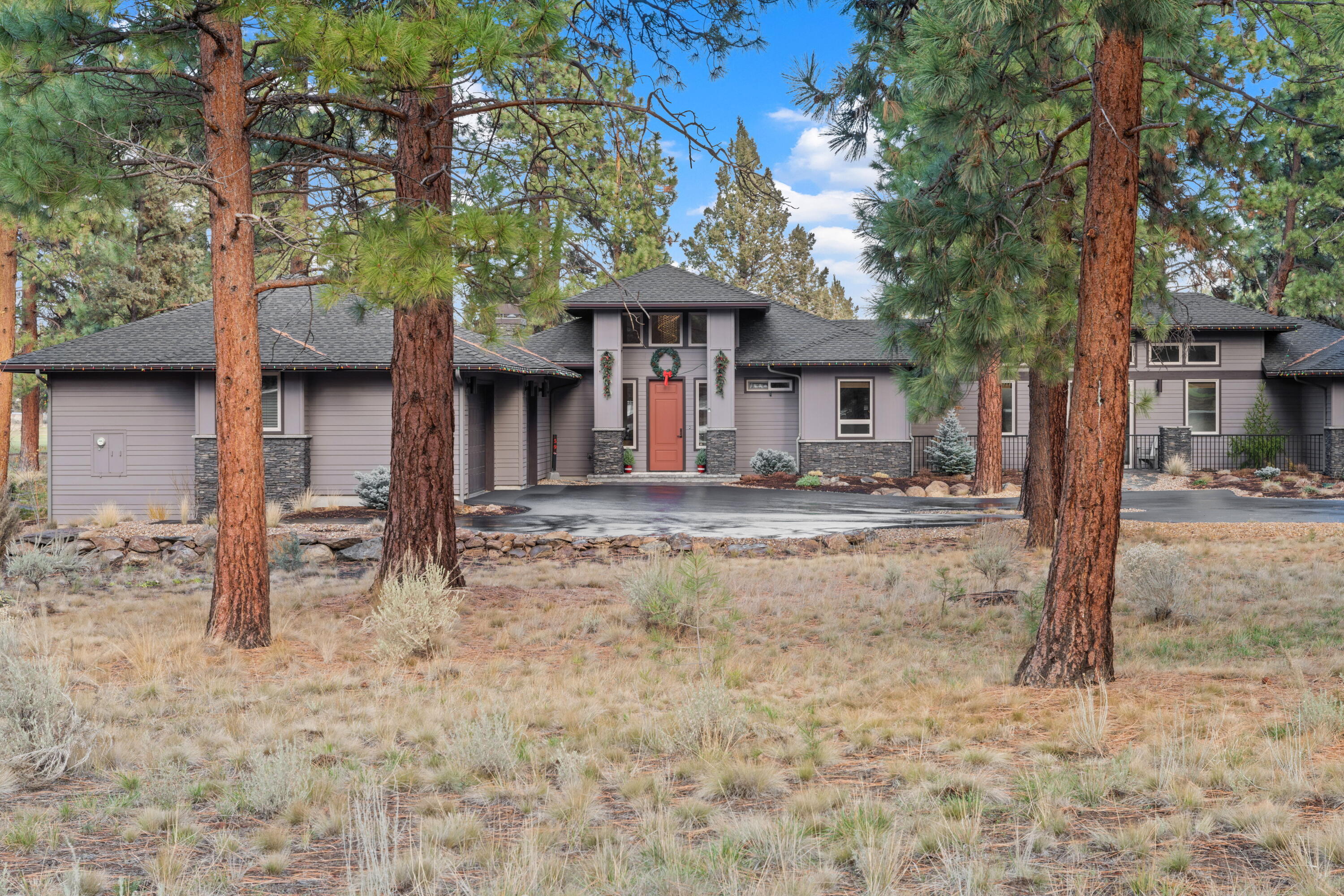 Gorgeous custom-built home in scenic and sought-after Aspen Lakes. Relish in plush, resort style amenities like gated entry, pool, pickleball and sports courts. The location is a dream, tucked away yet perfectly accessible. Upon entering the foyer you'll instantly notice balanced design elements and mesmerizing symmetry.  Natural light is highlighted in the quintessential modern kitchen design while island seating plus a separate built-in countertop bar ensures room for everyone. Clear pine ceiling adds texture and contrast, enhancing the natural warmth. A long, sunlit hall separates the primary suite from the guest bedrooms and office. Everyday life is kept tidy and organized in the impressively large mudroom. The covered back deck provides shelter amongst the towering pines to soak in the forest and 4th fairway views. Spacious 1,083sf oversized 3 car garage.