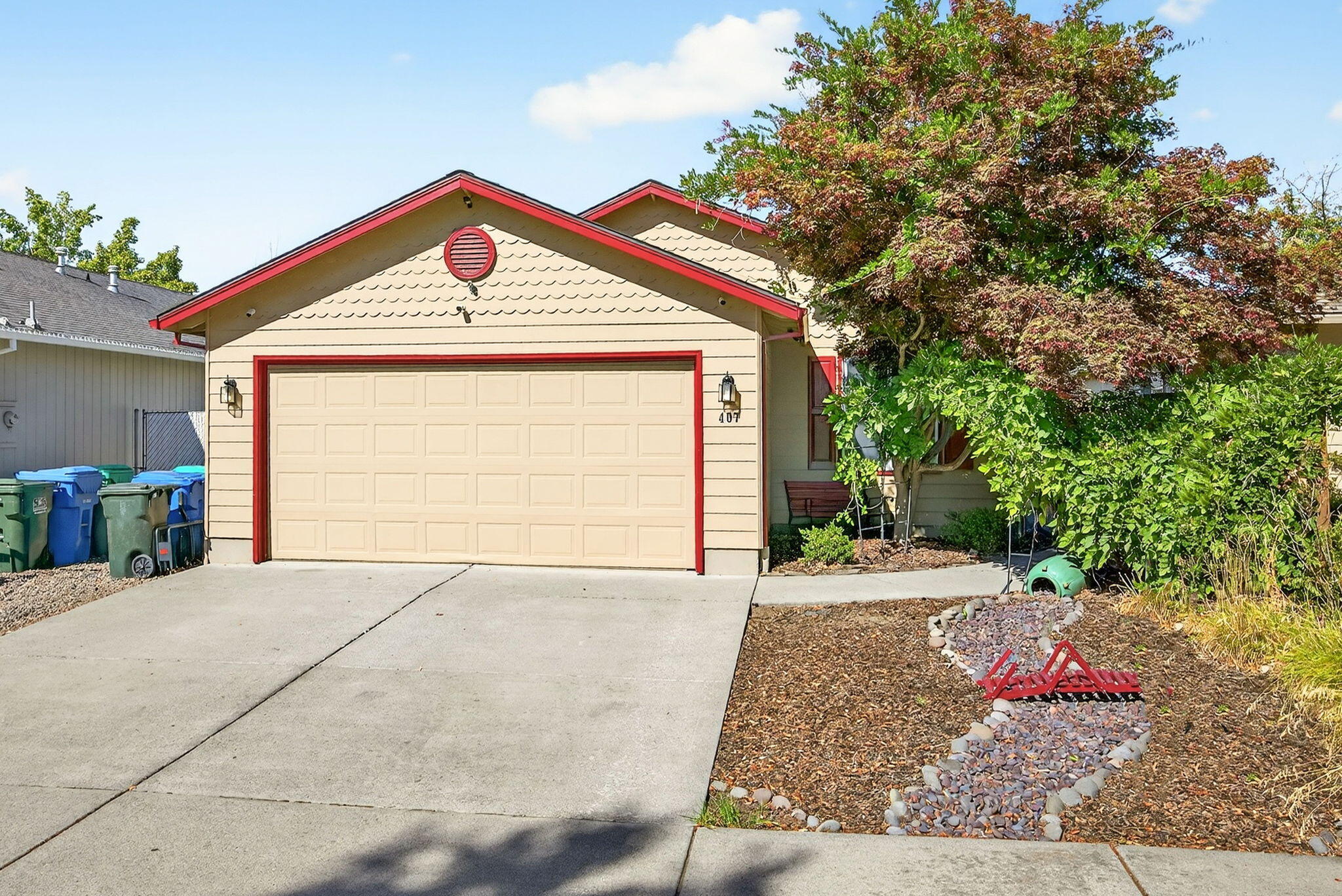 Turnkey Eagle Point home with new roof, HVAC, and oversized water heater in 2022, plus freshly painted exterior trim and gutters the same year. An open floor plan welcomes you with a tray ceiling in the living room, flowing into a dining area and beautifully updated kitchen with granite counters, pantry, new microwave installed this year, and all appliances included. A bonus space offers flexibility for a home office or flex space. The generously sized primary suite features a stunning ensuite with a walk-in tile shower. Two guest bedrooms share an updated bath with a jetted tub for relaxing. Custom tile with epoxy grout throughout helps prevent staining. Outside, enjoy a fully fenced backyard, low-maintenance front landscaping, and a two-car garage with storage. Ideally situated near Chamberlain Park and schools, offering easy access to recreation and daily conveniences. Equipped with a security system, this turnkey property is priced competitively and is ready for you to enjoy.