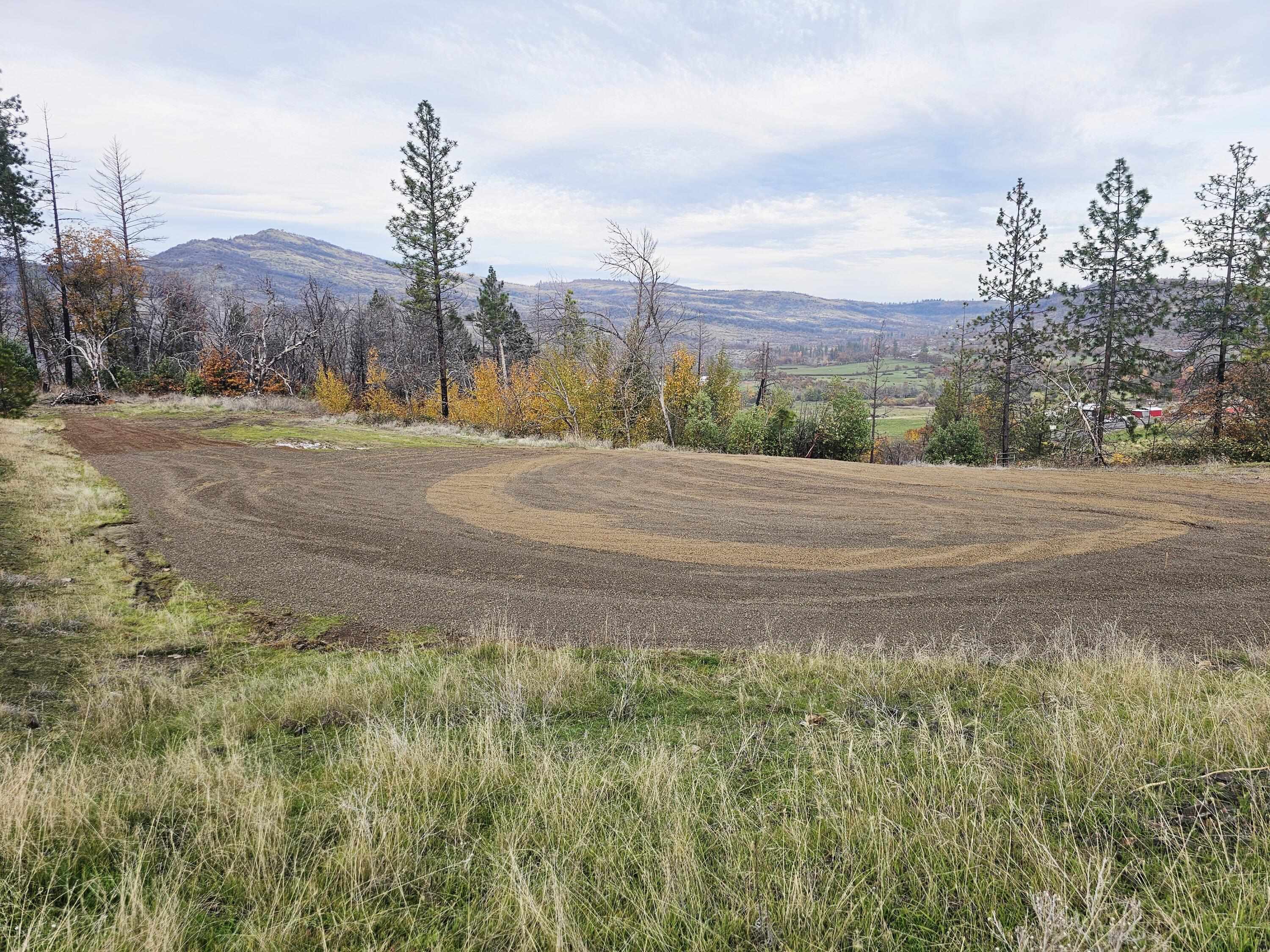 Come build your dream home on this scenic 10.76 acre parcel. EFU zoned with gorgeous views of the surrounding valley, rolling hills and mountains. This incredible property features a well graded and graveled driveway that curves to three freshly cleared/graded pads. A blend of open space, hills and a variety of oaks, pines and madrone. Per Jackson County Planning Dept property does have a vested homesite approval and an approved site evaluation for septic. Per seller property has a good producing well with a newer wellhead. Electricity is currently not hooked up but available at the road. Property is just past the 2-mile marker on Butte Falls Highway, about a 10 minute drive into the town of Eagle Point. Bring your vision and check out this piece of land. Buyer to do their own due diligence and verify all aspects of the property including uses, zoning, approvals and building requirements.
