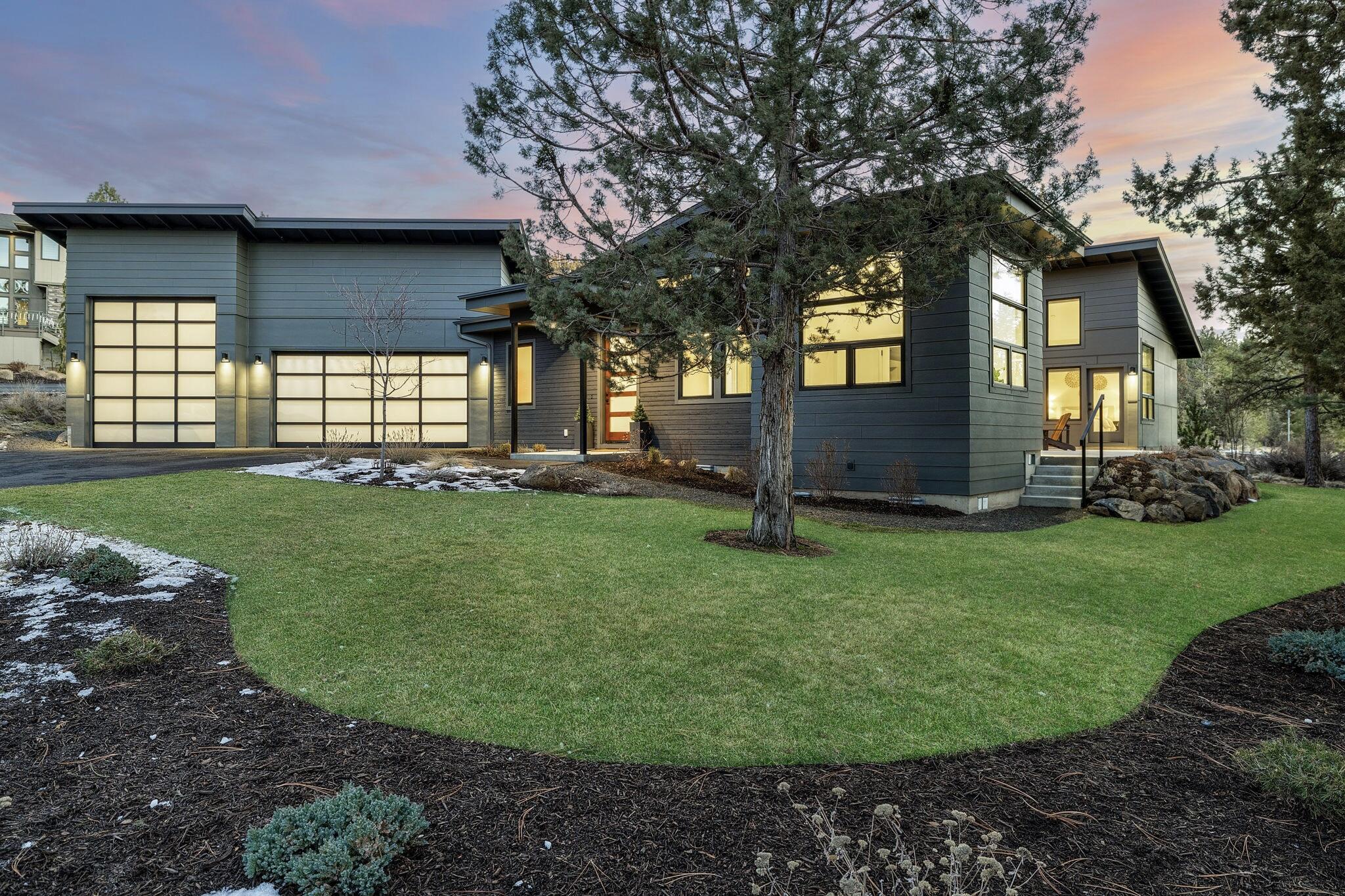 A single level modern retreat crafted in 2021, blending contemporary design, upscale finishes, and unmatched attention to detail. This 2,877 sq. ft. home features 3 bedrooms, 2.5 bathrooms, an office, and a media/flex room, designed for luxurious living. This home also features a 3 car garage w 1 extra tall/long ''Sprinter'' bay and a flat driveway.  European white oak wood floors flow throughout, complemented by a stunning double-sided gas fireplace separating the dining and great room. Natural light floods the space through beautiful upscale windows, creating a bright and airy ambiance. The chef's kitchen boasts Thermadore Pro appliances, sleek cabinetry, ample counters, a pantry and a water purification system. The primary suite is a private oasis with a spa-like en-suite and a custom designed walk-in closet. The spacious patio includes a custom fire pit, built-in gas line for grilling, and space for a hot tub. This home also has a view of Bachelor from the back of the property.