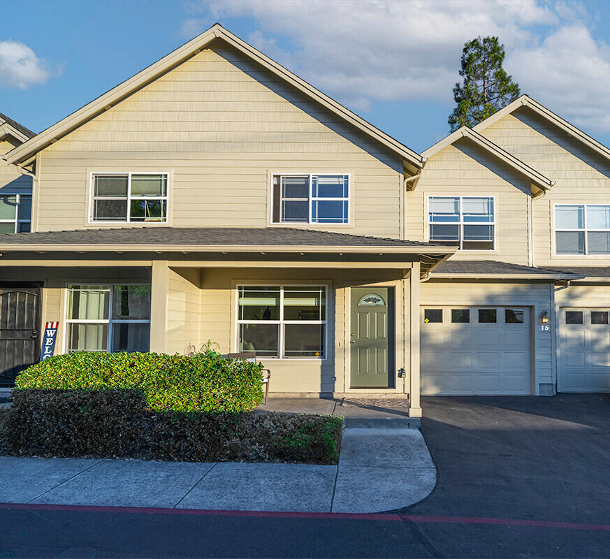 Welcome to this charming 2-story townhome in the desirable Ft. Wagner community. Featuring 2 bedrooms & 2.5 baths, this home shines with fresh updates including new carpet, new interior paint, new bathroom fixtures & vanity, & new window coverings. The interior has a spacious feeling with nice natural light. Living room has picture windows & nice kitchen opens to a roomy dining room. Bedrooms are well-sized with primary on upper level with 2nd bedroom & 2nd full bathroom. The inviting layout offers comfortable living spaces, while the darling private patio & landscaped fenced yard extend your enjoyment outdoors. Ideally located close to downtown Talent, you'll enjoy easy access to shopping, dining, & community amenities. Move-in ready & beautifully maintained. Low HOA dues of just $185 per month cover exterior maintenance, landscaping, & trash service—making living here convenient & worry-free. This home is perfect for those seeking low-maintenance living in a welcoming neighborhood.