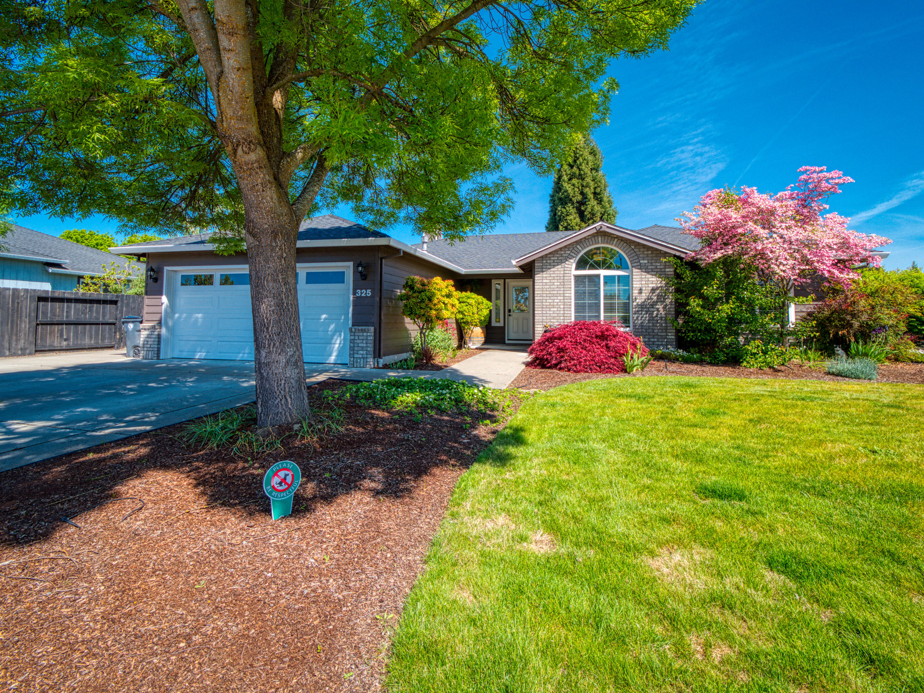 ''True Pride of Ownership'' 1700 plus sq. ft. home. Located in a desirable Central Point neighborhood, close to schools and shopping. Home sits on a Quarter-Acre corner lot, with off street parking. Abundance of natural light, picture windows, surround sound, vaulted ceilings, with a great room feel. Master suite with french doors to the back yard, double sinks, tile shower, and walk-in closet. Beautifully landscaped yards, covered deck, natural gas fire pit, corner water feature, and two RV Parking pads, complete this package.