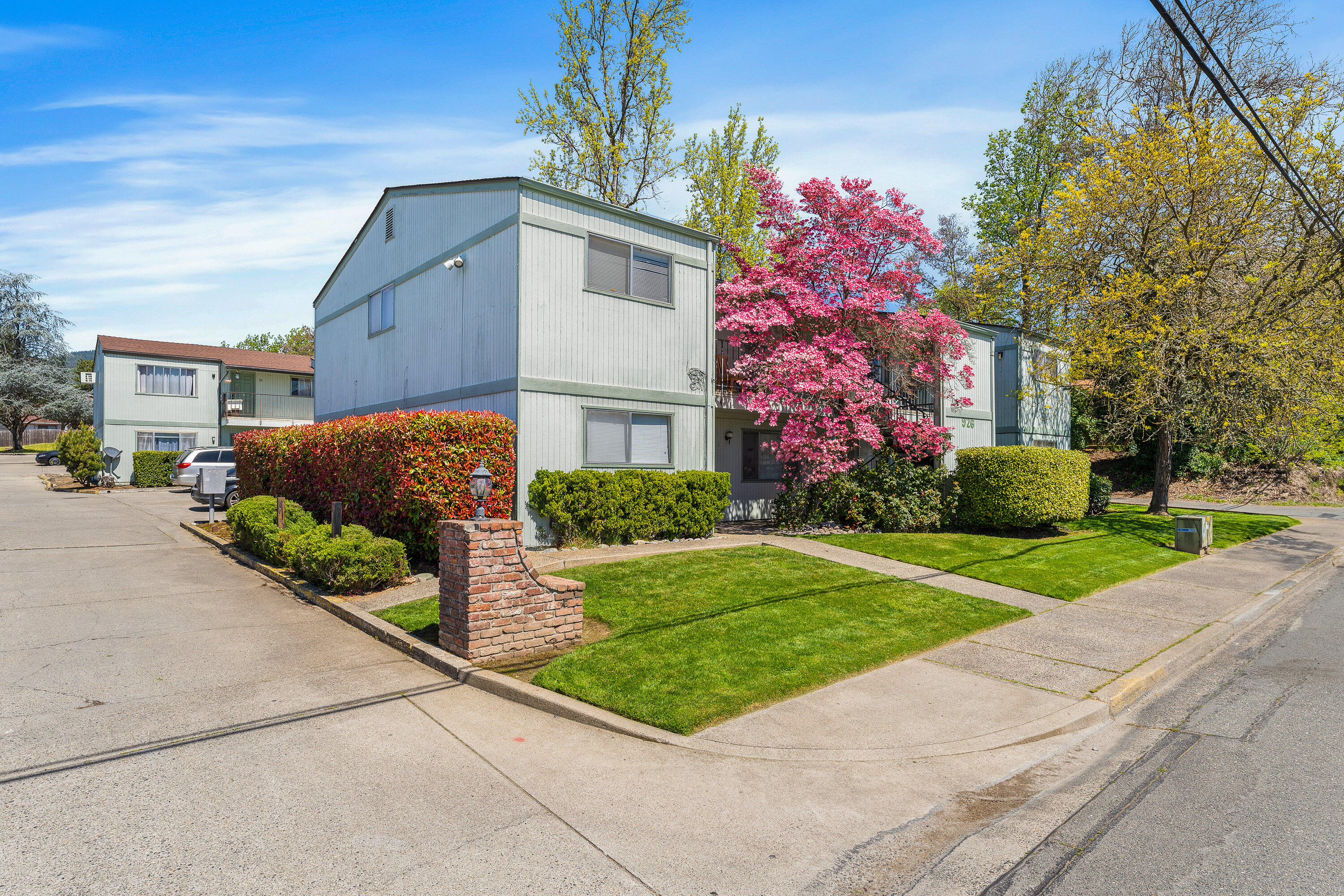 Strong rental market makes this a hot property for cash flow. 10 unit apartment complex located in the Grants Pass Opportunity Zone makes it even more attractive. The complex has 2 buildings on separate lots,  building 1 has 4 units and building 2 has 6 units,  each building could be  sold separately. Building #1 4088 sq. ft., two 1 bedroom units and two 3 bedroom units. Building #2 5668 sq. ft., four 2 bedroom units and two 3 bedroom units. Additionally there is a small coin op laundry room and 10 small storage rooms for tenants possessions. Buildings appear solid, frame construction with concrete block dividing walls between units, slab foundations and roofs replaced approx. 3 years ago on the 4-plex  and 5 years ago on the 6-plex. Some rents are below market so there is room to grow the income further. All tenants are month to month, see attached documents for income and expenses.