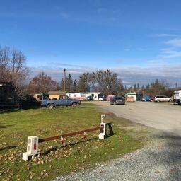 8+ acres zoned for commercial use RIGHT OFF INTERSTATE 5 at the Merlin interchange. This property is 4 tax lots and 1 tax lot is currently a Mobil Home Park. The property fronts Camp Joy Rd and Merlin Rd. There are many possibilities for highly desirable property with high visibility from Interstate 5