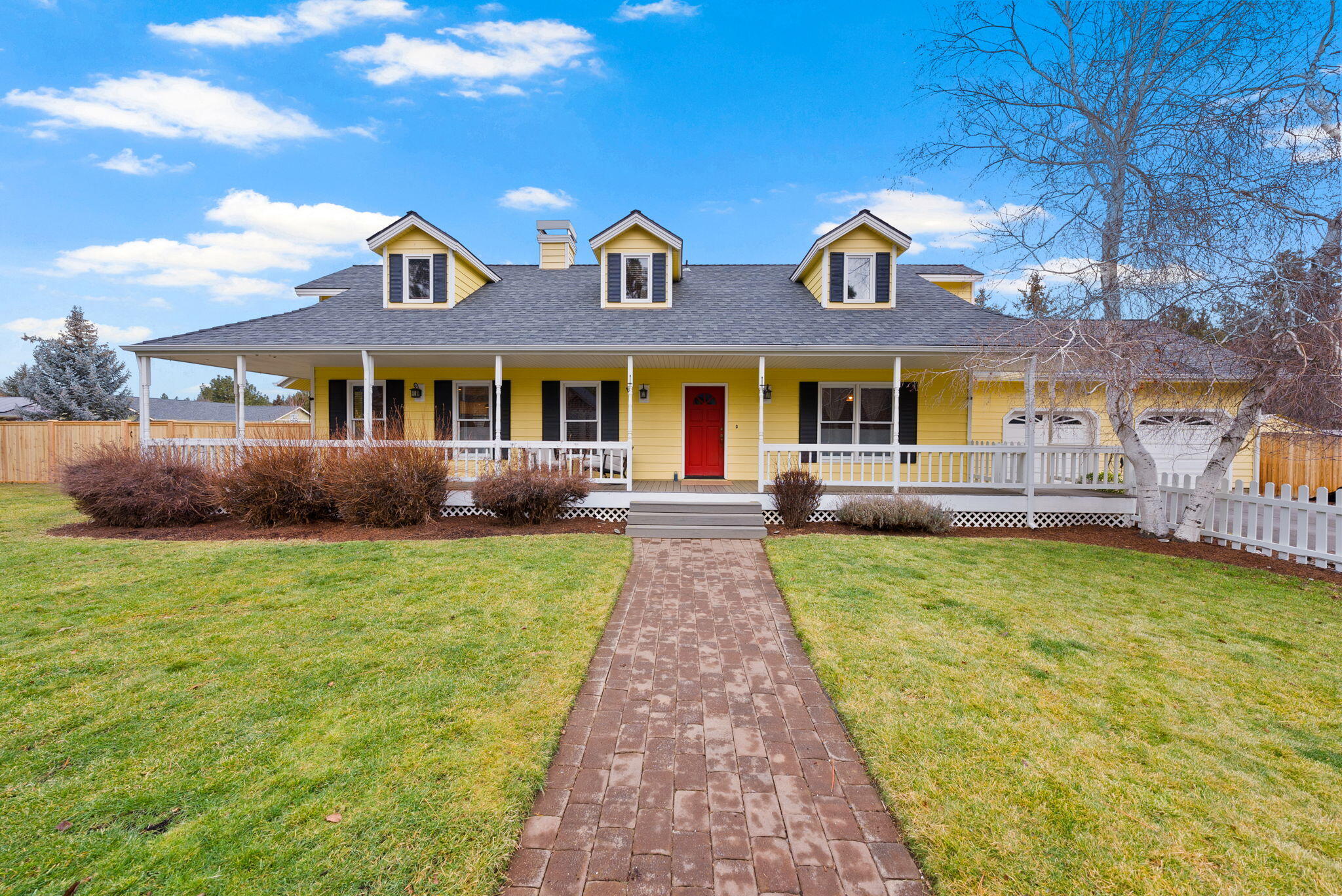 Fall in love with this beautifully updated farmhouse, perfectly situated on a large fenced corner lot in town. Enjoy a classic porch with low-maintenance composite decking and a generous yard featuring a paver patio, water feature, chicken coop, woodshed, and RV parking. Inside, timeless charm meets modern comfort with a remodeled kitchen showcasing a stainless-steel farmhouse sink, custom cabinetry, new appliances, and gleaming hardwood floors. Gather around the cozy wood-burning fireplace in winter or watch the snow fall from the inviting family room addition. The spacious primary suite features reclaimed 100-year-old barn wood accents and a fully remodeled bath, creating a warm and welcoming retreat. Additional updates include a new water heater, washer and dryer, refrigerator, and dishwasher, along with a newer hot tub, roof, and heat pump. This one-of-a-kind property perfectly blends character and convenience in the heart of Sisters, Oregon.