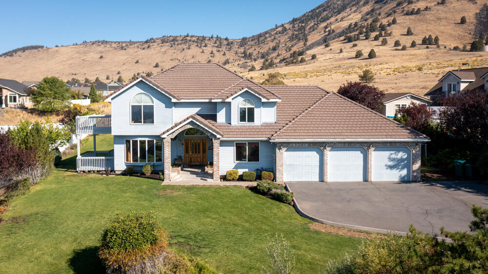 BACK ON THE MARKET: Fabulous Views over the Basin to Mt. Shasta! Custom home with five-car garage with tall ceilings on an oversized lot & level front & back yards at the top of Basin View Drive. Open space on the hillside behind. Three bedrooms upstairs plus 4th room/office on the main level with attached full bathroom. Cozy family room with built-in shelving plus a living room with vaulted ceiling & sweeping views. Cook's delight kitchen is spacious with lots of cabinets, stainless appliances, double oven & both formal & informal dining. Spacious primary bedroom upstairs with spectacular views, natural lighting & an en suite bathroom with Jacuzzi tub, double sinks, & ample walk-in closet. Five-car finished garage with tall ceilings: Two tandem bays & one single bay. Big pantry & laundry room with sink. Wrap-around deck is perfect for outdoor entertaining plus a long-lasting tile roof & a heated driveway! Seller will provide a 1-yr home warranty. Clear pest/dry rot report on file