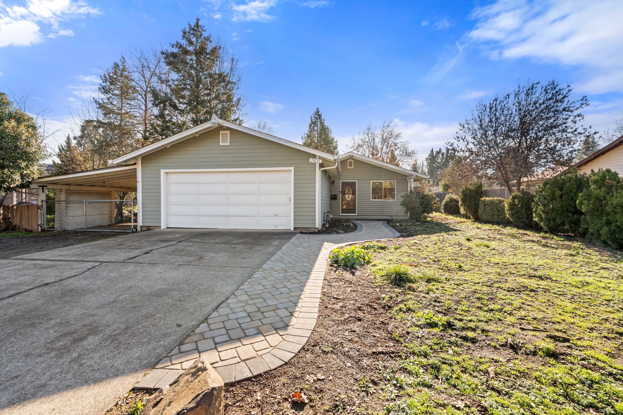 Welcome to 2021 Taylor Road in desirable Central Point, Oregon! Conveniently located near Twins Creeks and just minutes from downtown convenience or country recreation! This home offers a spacious lot with plenty of parking and storage with its two car garage and carport! Inside you'll find 3 bedrooms, 2 bathrooms and a 1,296 sf, thoughtfully designed and functional floorplan. The fully fenced, large back yard provides privacy and tranquility. Don't miss the opportunity to make this house a home, schedule your tour today!