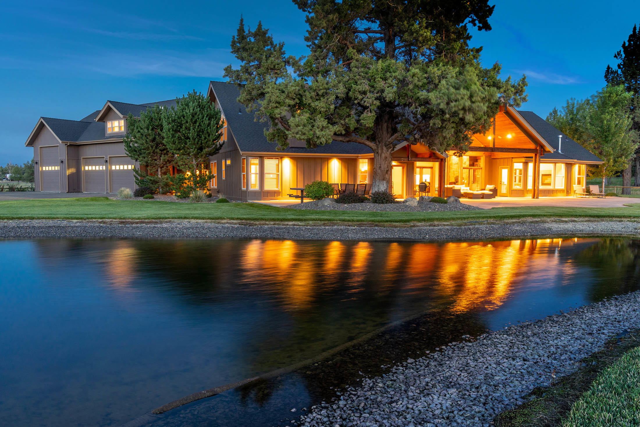 Stunning custom built home located on the extremely desired and fast growing NE side of Bend Oregon. This 19.54 acre property is extremely private, has 12 acres of irrigation and sweeping mountain views from the entire backside of the home.  When walking in the front door of your new 5600 sq ft home you have vaulted ceilings with natural light beaming in the windows, huge gourmet kitchen with an abundance of counter space, storage and room to entertain any party size. The oversized living room has gorgeous rock work, wood beams, cascade mountain views and access to the private back patio and pond directly outside creating the ultimate ambiance for relaxation. All Bedrooms are large and can accommodate any arrangement needed. The master suite has vaulted ceilings, mountain views with a sitting area and double sided fireplace over the soaking tub. Master also includes walk in tile shower, large walk in closet and open double vanities.  This home offers additional 4 bedrooms, bonus room t