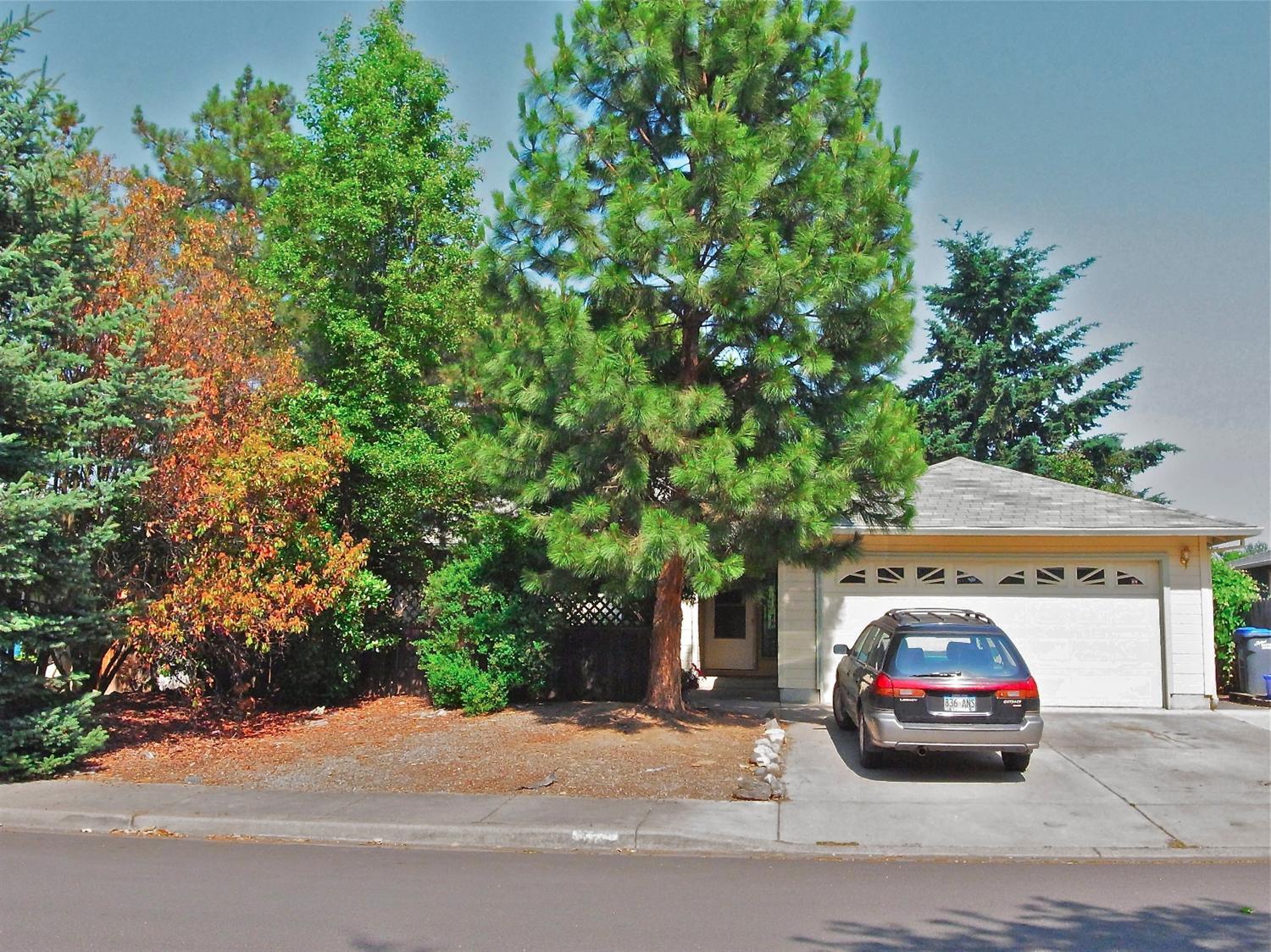 Back on market! Purchase price includes new roof (currently collecting bids). Clean and well-maintained, this 1290 sqft single level home has 3 bedrooms, 2 baths, 2-car garage and a large yard that is fully fenced with a patio. It's close to school and downtown Talent but feels private with open farm lands, rolling hills and mountain views across the street.