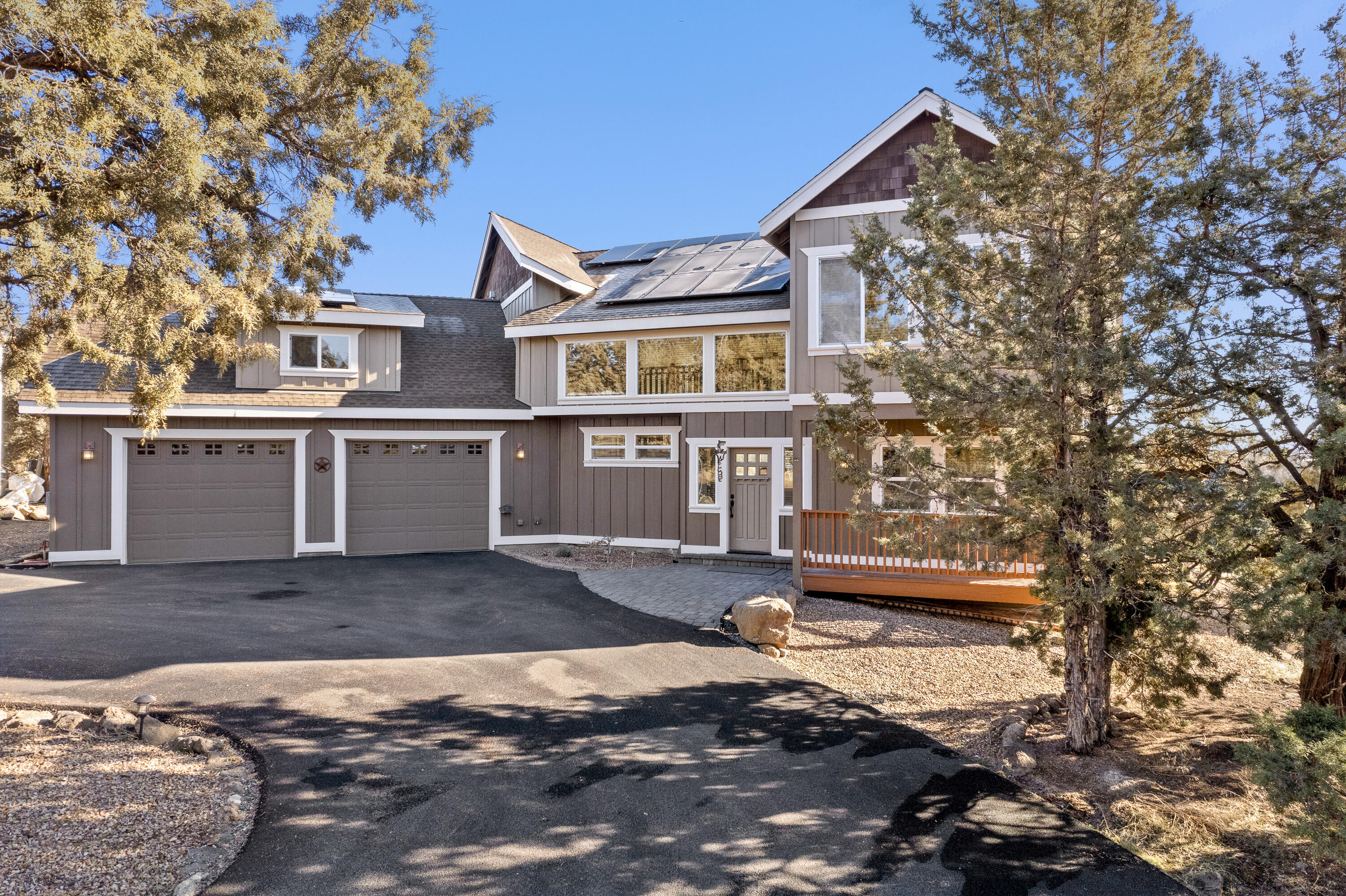 Whether you are the discerning buyer in need of a quality built custom home, or are looking for gorgeous views & privacy, a 40'x30' shop, gardens, room to roam & play, or an in-law apt? This property offers it all! This stunning Custom Craftsman home features high end finishes & upgrades throughout incl. a new 24.8KW Solar System, custom cabinets, pellet stove, salt water hot tub, A/C & new int/ext paint. Home offers dramatic & open vaults, large picture windows, maximizing views & adding ample natural light to the whole house! Main level offers BD, full BA, dedicated office, great room, gourmet kitchen w/ SS appl, granite counters & wood flooring. Upstairs is open to below & offers the perfect primary suite w/ Mtn Views, a 455 SF bonus/4th & great BD separation! Property is located on a truly unique & low maintenance private setting in the highly desirable area of Tumalo, providing something for everyone while offering energy efficiency, low overhead & addt'l investment opportunities.