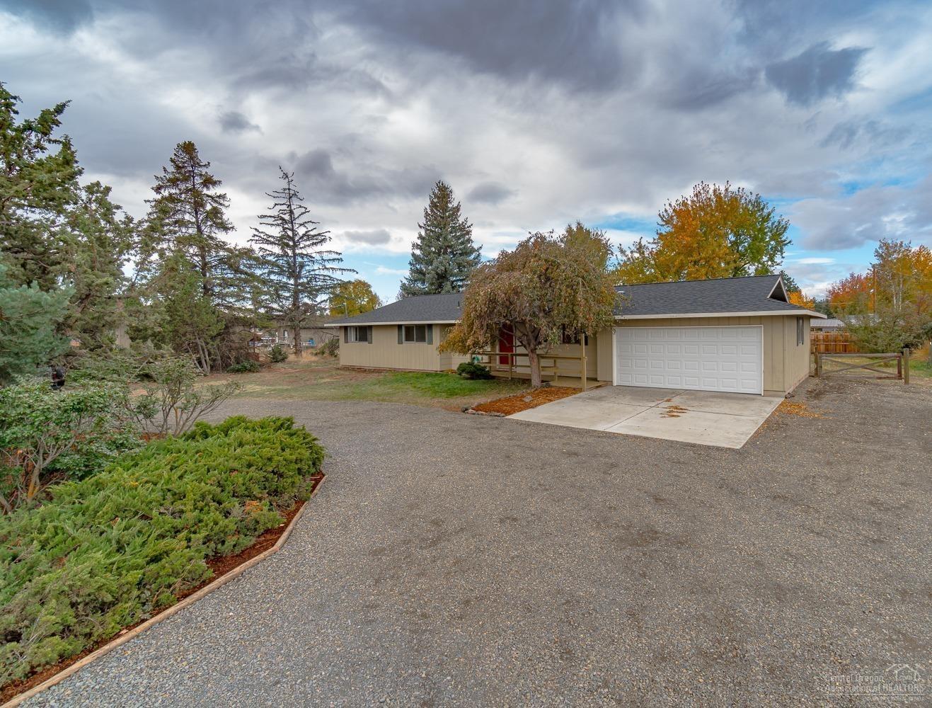 Spacious, well kept single level ranch-style home on large lot in desirable SW Redmond with RV parking & room for all the Central Oregon toys! Enjoy the large, light and bright kitchen with breakfast bar and dining area that opens to a nice deck and beautiful, private backyard. Thoughtful, open floor plan with family room and natural rock fireplace w/pellet stove. Circular driveway, 2 car garage with plenty of built in storage. Great location with privacy, yet close to the Dry Canyon walking trails, shopping, restaurants and downtown Redmond!
