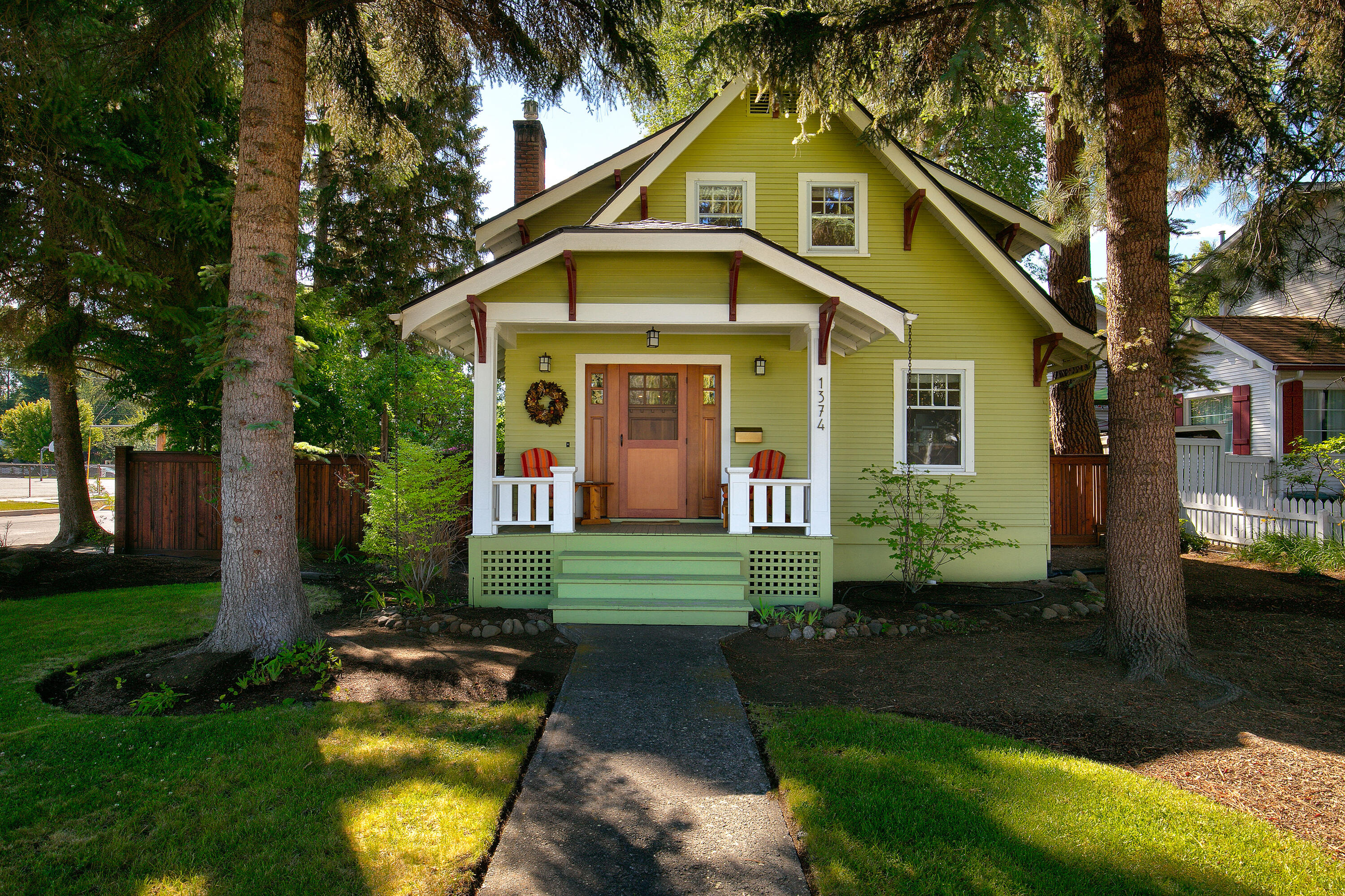 A beautiful home with a Bend lifestyle inside and out, close to Schools, Parks, West Side Amenities, and Downtown a block to Deschutes River —a 2-story NW Craftsman style with a Heated Basement.  A large, welcoming front porch brings you into the open main living area with higher ceilings, great natural light, a gas fireplace, and a fantastic mantle.  Natural hardwood flooring in the home's living areas. Sunny, open kitchen with eating bar, beautiful wood cabinetry, ribbon glassed doors, matching wood-faced refrigerator, dishwasher, and gas range. Private dining area, well-lit naturally. A convenient guest bedroom, office, or studio is on the main floor. Up the hardwood stairwell is the primary bedroom, with built-in storage and a walk-in closet.  There is an oversized bath and more great natural light.  Bedroom three and laundry area complete the upper floor. An amazing fenced back and side yard, back alley entrance to the garage, and extra off-alley parking. Enjoy your Bend Life!