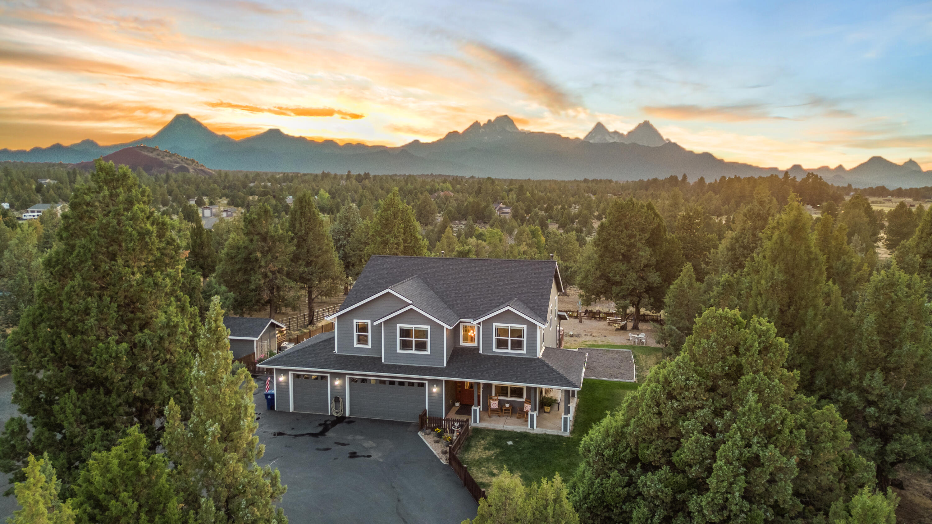 Close in acreage w/Cascade Mountain views in the sought-after Sundance neighborhood. This almost 5 acre property offers the perfect balance of privacy & convenience, with Caldera High & Alpenglow Park just 4 miles away, Costco 8 miles & the vibrant Old Mill district only 10 miles away.
Spacious gourmet kitchen that flows into the dining area & expansive great room. Generous proportions of this space ensure that all your entertaining needs are met. The spacious office & full bath on the main floor provide convenience for guests or a home-based business.
Ample storage, including a 24'X40' shop with a wood stove, multiple parking areas, RV hook-up & dump, cater to your storage & rec. needs. For horse enthusiasts, there's a loafing shed & tack room. Imagine going for a ride right out your doorstep. Don't miss the opportunity to embrace a lifestyle that combines serenity w/access to modern amenities. Inquire today about the 2.5% Seller's assumable loan!