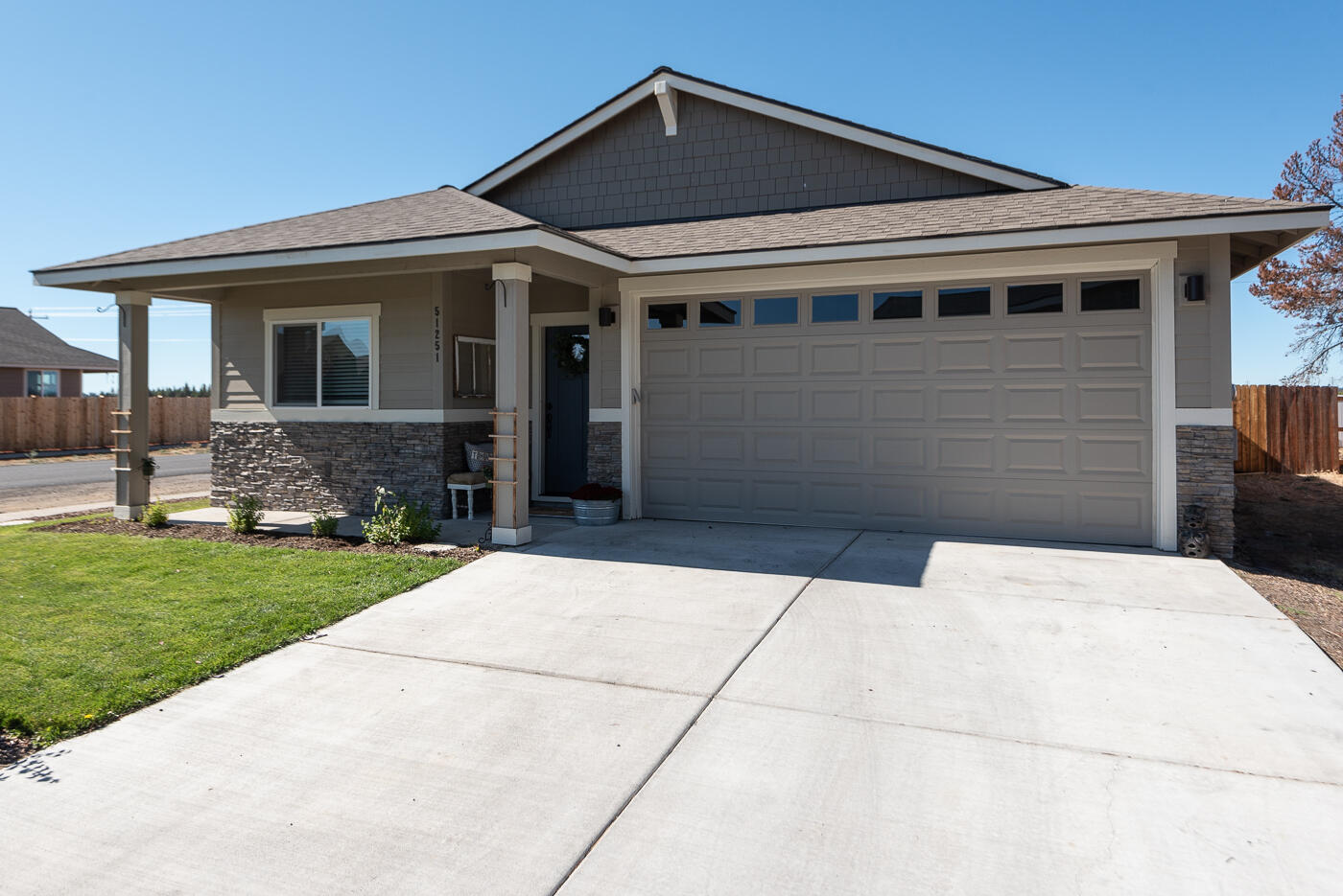 Immaculate single level NW Ranch style home situated on a .14 acre corner lot with mountain views. Completed in Summer 2019 this 1,456 sq. ft. Arbor Built home features 3 bedrooms / 2 bathrooms, spacious open floor plan with tons of natural light plus many builder upgrades including designer chosen finishes, laminate flooring throughout main living area and fully finished garage. Beautiful primary suite with large bath, walk-in closet and double vanity. Well separated guest bedrooms and full guest bath. Full sized laundry room and forced air heat. Spacious fenced backyard with raised garden beds and extra side parking and storage area. Conveniently located in the desirable neighborhood of Huntington Meadows near schools, restaurants and shopping.