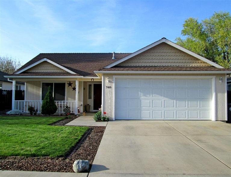 Delightful home in SW Medford. From the sweet front porch, enter into the charming comfortable interior splashed with warm inviting colors. Tile counters in open kitchen, island with breakfast bar & pantry. Private master suite with vaulted ceiling and walk-in closet. Large covered patio off the dining area. Spacious fenced backyard.