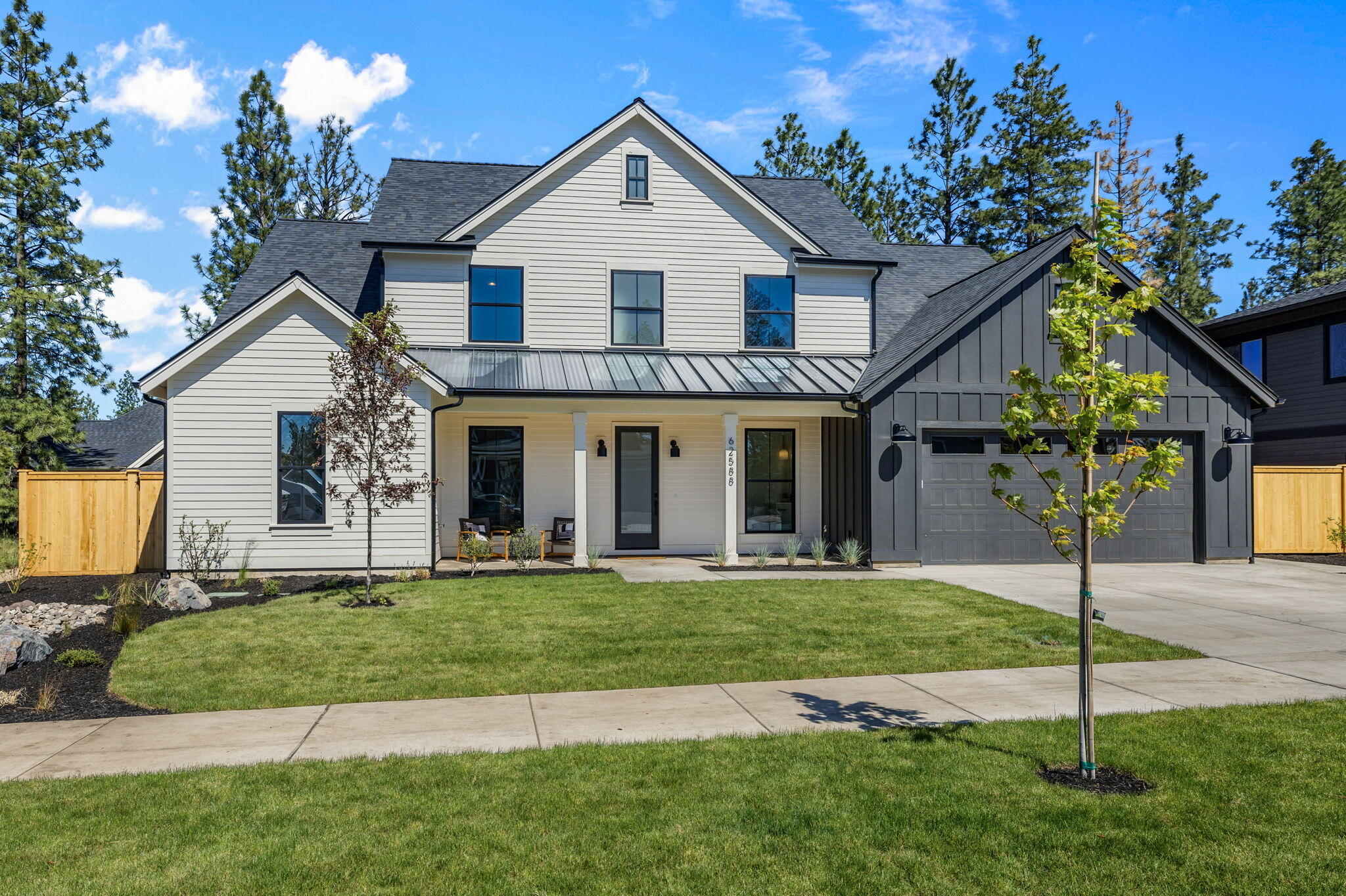 Presenting a stunning new construction in the coveted Shevlin West community. Step inside to beautiful hardwood flooring throughout the elegantly designed open-air living spaces. The heart of the home is the gourmet kitchen, featuring a 10 foot island, custom lighting, and top of the line stainless steel appliances. The main level offers a primary bedroom suite with a spacious bathroom and closet featuring a second laundry. Additionally, a versatile office, den, or additional bedroom on this level. Upstairs, the home includes two bedrooms sharing a Jack and Jill bathroom, and a larger room with a beautifully  designed en-suite bathroom, ideal as a guest suite or bonus space. Cascade Mountain views are visible from the upper windows. Outside, the landscaped yard provides a serene retreat with mature foliage and fencing. This home offers luxurious living and access to natural beauty, trails, amenities, and top rated schools in Bend. Make this exceptional C&L Custom Home yours today!