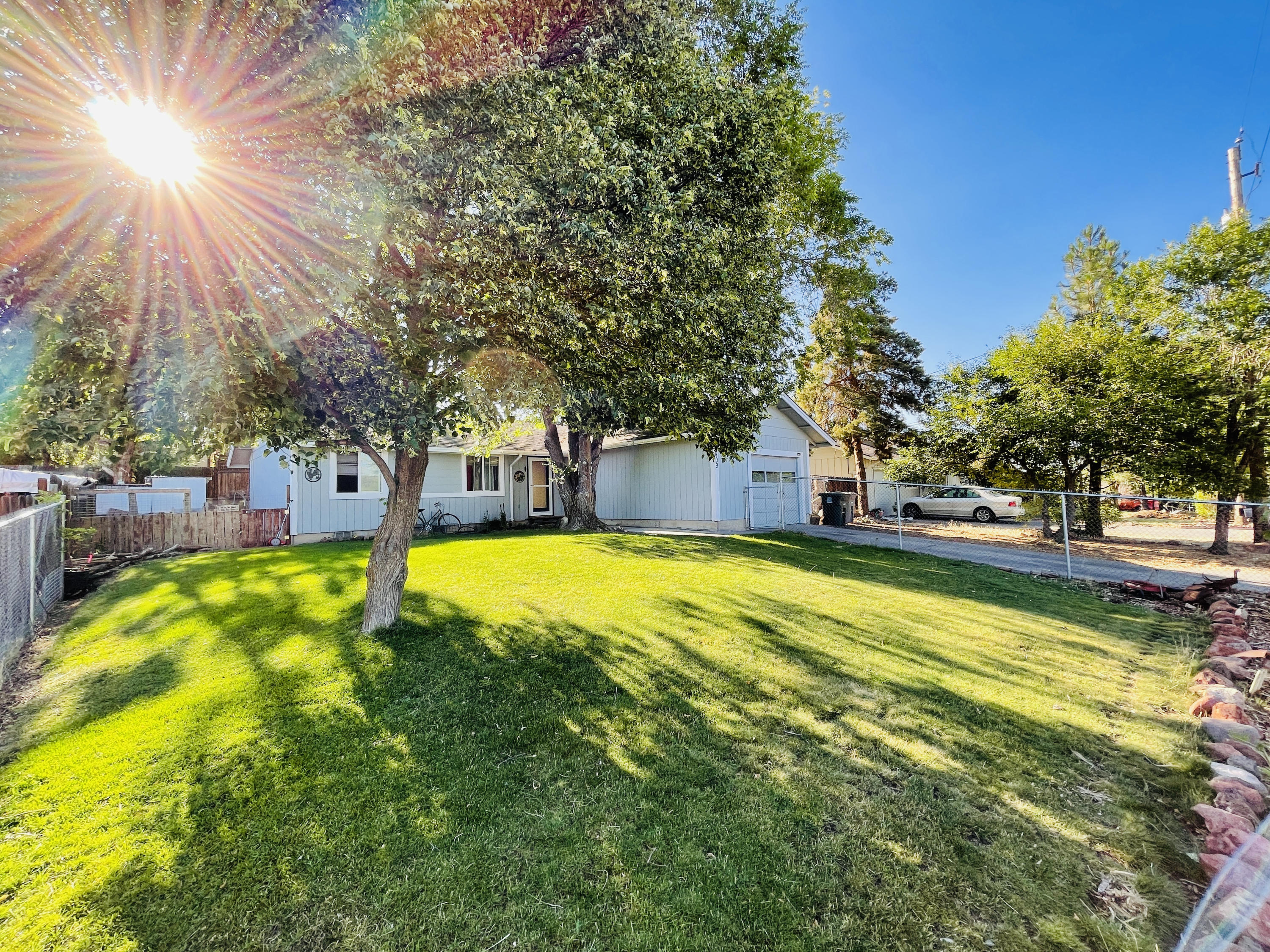 Very nice 3 bedroom 1 bath with garage, beautiful front yard with Shade trees and nice view of town, raised garden beds, private back yard with deck, fenced area with a chicken coop, updated windows, gas furnace, wood stove, swamp cooler, tile, laminate, and carpet flooring. Must see to appreciate. Make your best offer.