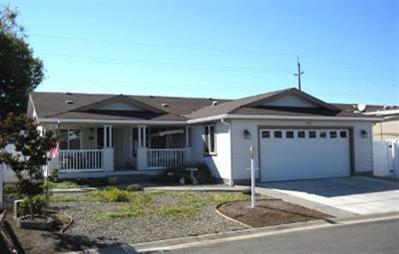 Owner will carry loan on this immaculate Energy Star, triple wide manf. home in quiet 55+ park. Built in 2006 this spacious 1649 sq ft home has vaulted ceilings, ceramic title & carpet throughout, large X-wide 2 car attached garage. Large 20 x 12 front deck with TrexDecking, partially covered 12x44 rear patio with exposed aggregate concrete. This home is loaded with extras & upgrades: Large roomy kitchen w/Cherry wood cabinets, stainless appliances, informal breakfast area, formal dining, French doors lead to large master bedroom, large garden tub in master bath, heat pump for heat & A/C.
