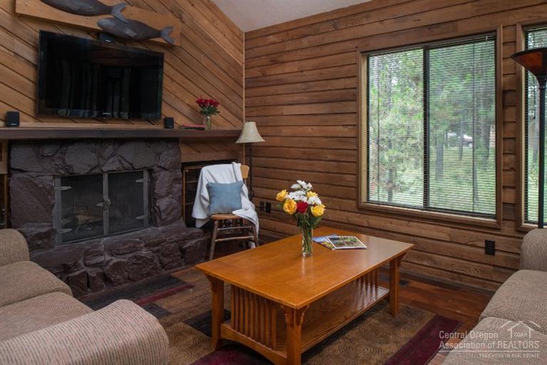 Location! Location! Location! Near the majestic Deschutes River and on a street of beautiful homes. This 3 bedroom + loft has been remodeled in 2013. New floors, kitchen counters, cabinets, appliances, and bathrooms. Enjoy the hot tub or BBQ on the deck while looking at acres of common area. This cabin is a real gem! Wood burning fireplace, vaulted great room & bedrooms. Fully furnished. There is a path w/ a bench at the end of the cul-de-sac that leads to the river for gazing at the view or casting a pole.