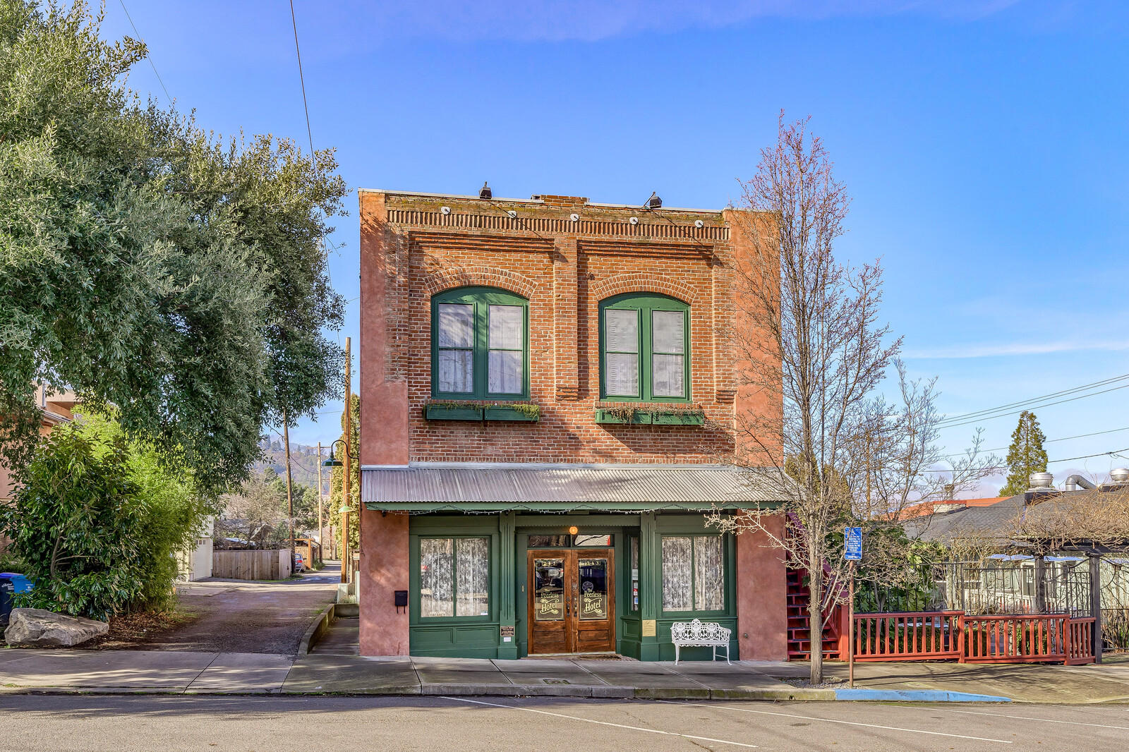 Rare opportunity to own a ''turn-key'' hotel in the heart of the Railroad District in beautiful Ashland Oregon. The Peerless Hotel Building, originally built in 1904 (once a railroad-workers' boarding house) was completely taken down to the studs in 1991 for a major, historically compatible, seismic renovation by the current owner. Finished in 1994, a time period masterpiece had been created and has since been honored by the Oregon Historic Commission. Modern day amenities and systems, yet all of the character and style of a time long ago. Decorated with quality furnishings, art, and antiques, provide an elegant and comfortable ambiance. There are six spacious guest suites. Common areas include an inviting lobby entrance w/fireplace, a relaxing lounge area w/access to a lovely back courtyard patio and kitchen space. Four off-street parking spaces. E-1 Zoning does allow for a usage change to commercial/ residential, if one so desires to have an urban live and work space.