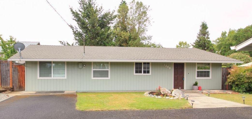 Cute and comfortable, light and bright. This gem is move-in ready. This 3 bedroom, 2 bath home has many updates including double paned windows, granite counter tops, new lighting, laminate floors and carpeting. Nice open floor plan with French doors to patio. Large master with built-ins and double closets. Great East Medford location. Large .25 acre lot nicely landscaped including garden area, grape arbor and shed.