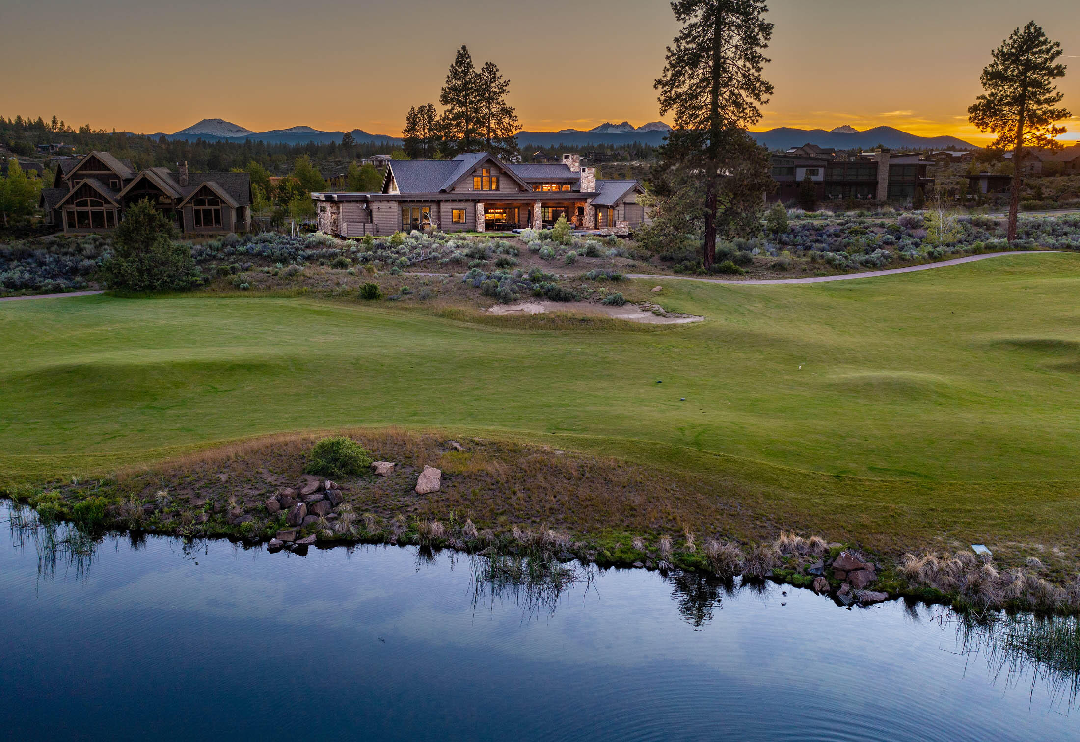 Set on one of the finest golf course settings in Tetherow, this custom home has left no detail overlooked and is perfectly situated and designed for maximum year-round enjoyment. High-end finishes include Hewn wide plank white oak flooring, Starmark knotty alder cabinetry, Restoration Hardware lighting, Anderson windows and Thermador Appliances, providing the luxury you would expect in this one-of-a-kind Tetherow home. Comfort and convenience couldn't be easier with remote controlled and automated blinds throughout, a game room with projector, and a Control4 system for your entertainment needs. The outdoors are brought in through 3 oversized sliding doors and open to an unparalleled golf and pond setting to the rear. Year-round outdoor living has never been easier with overhead heaters and fan, fireplace, tv, sound system and in ground 15x20 hot tub. This home must be experienced in person, so schedule your tour today.