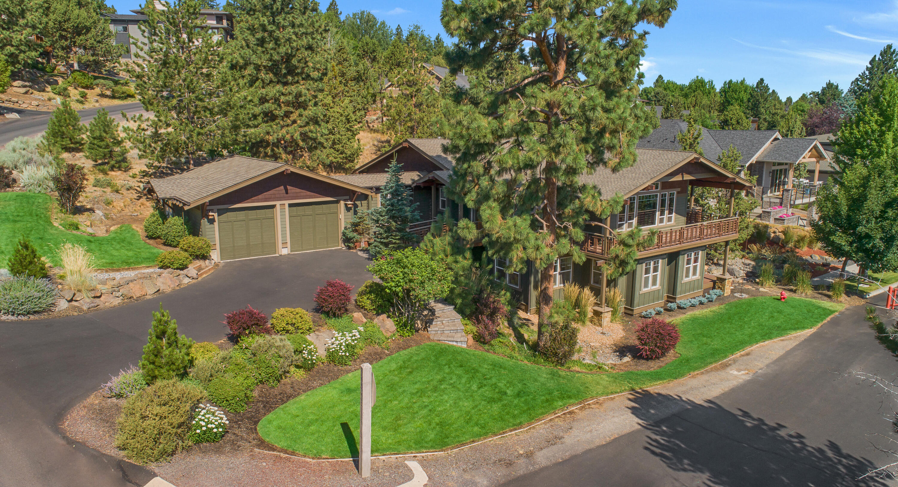 Gorgeous open floor plan home features large windows and wrap-around decks with panoramic views. Located in a highly sought-after Awbrey Butte neighborhood close to parks, golf course, and trails, it is the perfect location to enjoy all Bend has to offer. This house is ideal for both tranquil days at home enjoying the sunrise and entertaining. The airy great room features high box-beam ceilings, a gas fireplace, built-ins and bamboo floors that flow seamlessly into the dining area and kitchen with walk-in pantry and granite countertops. The roomy primary suite has a fireplace, walk-in double shower, and deck access. The main level also includes a study, powder room, and wine cellar and lives like a single-story house. Downstairs offers a bonus room, full bath, 2 bedrooms and guest deck. Enjoy the peaceful corner lot with a gated side street. A flat driveway and a tandem 3-car garage with no stairs to the main level add to the convenience. Ample storage with many updates and features.
