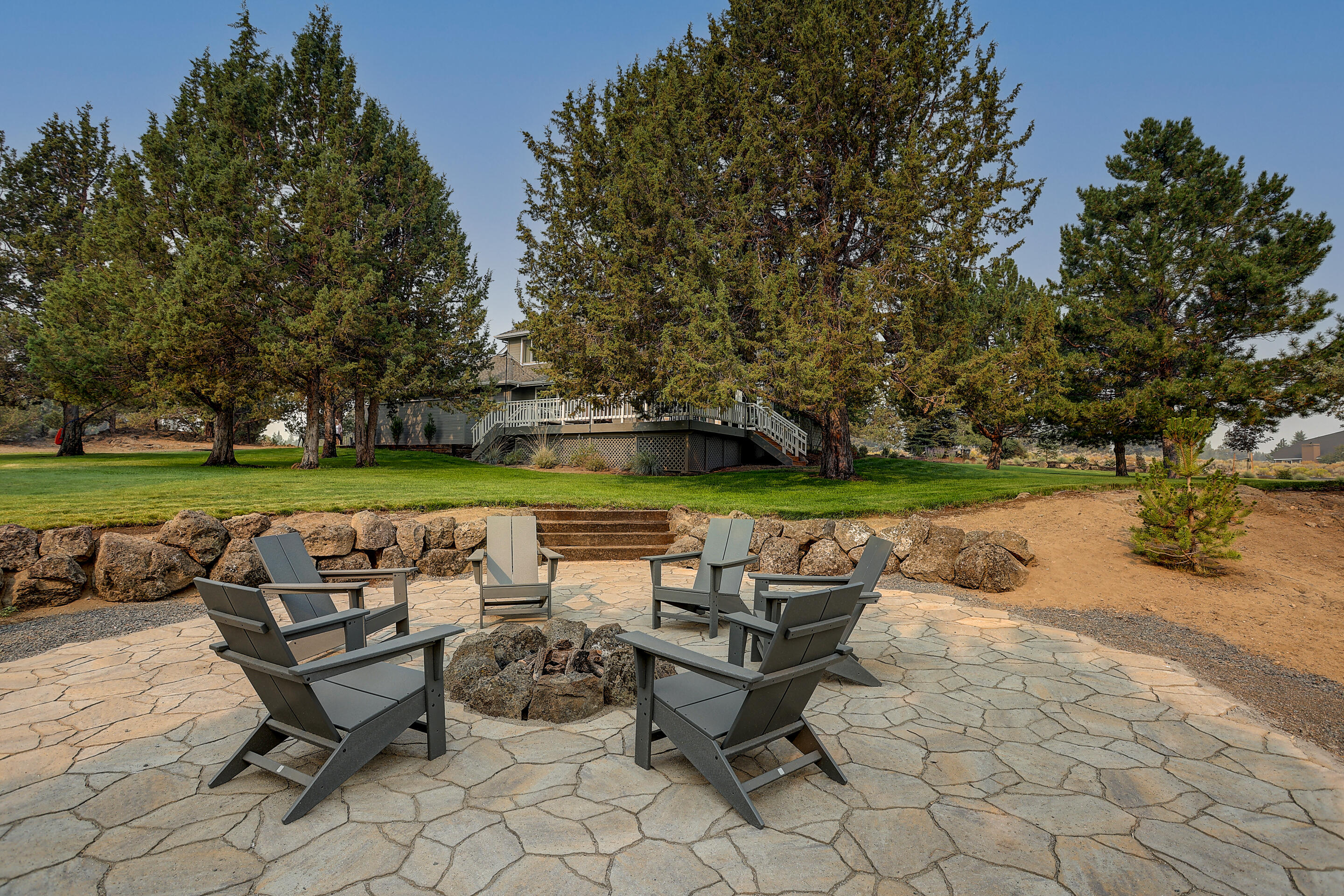 Introducing this beautifully remodeled home in the coveted neighborhood of Lane Knolls. Every inch of this home has been methodically updated inside and out. Positioned on a corner lot with 2.67 acres, new landscaping, firepit area, and plenty of grass to enjoy all of your outdoor games. The main floor boasts an open, great room floorplan with vaulted ceilings, lots of windows to bring in plenty of natural light, hardwood floors, a large laundry/mudroom, solid surface counter tops, and newly installed french doors leading out to a large deck. Upstairs you will find a beautifully appointed primary bedroom with a completely renovated on suite bath, 2 secondary bedrooms and a little bonus area to use as your heart desires. This house is absolutely stunning!