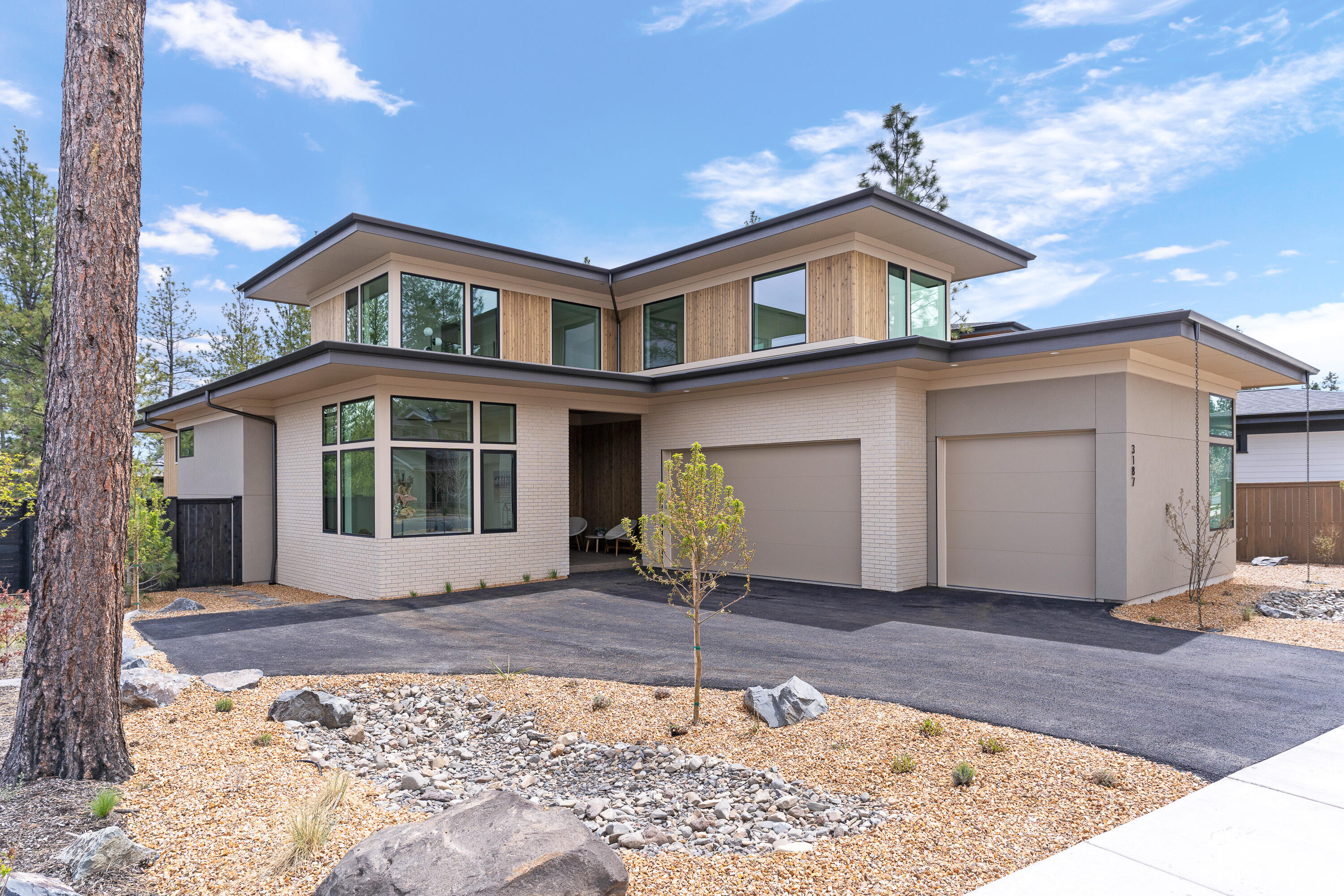 Discover the allure of mid-century modern living in this stunning Sunwest Builders home, nestled within the converted Discovery West neighborhood. Crafted with precision and flooding with natural light, this residence boasts a seamless open floor plan, adorned with 12' high ceilings and expansive windows in the great room. Hosting gatherings is effortless in the well-equipped kitchen featuring an oversized island and abundant storage. The main level boasts a serene primary suite with deck access, complemented by an office, mudroom, butlers pantry and laundry room. Upstairs, find a bonus room, three bedrooms, and two full bathrooms. Embrace the beauty of Discovery Park from this .21-acre landscaped lot. This home is enhanced by an attached 3-car garage, offering both elegance and functionality in every detail. This home embodies sophistication and comfort, come see it today!