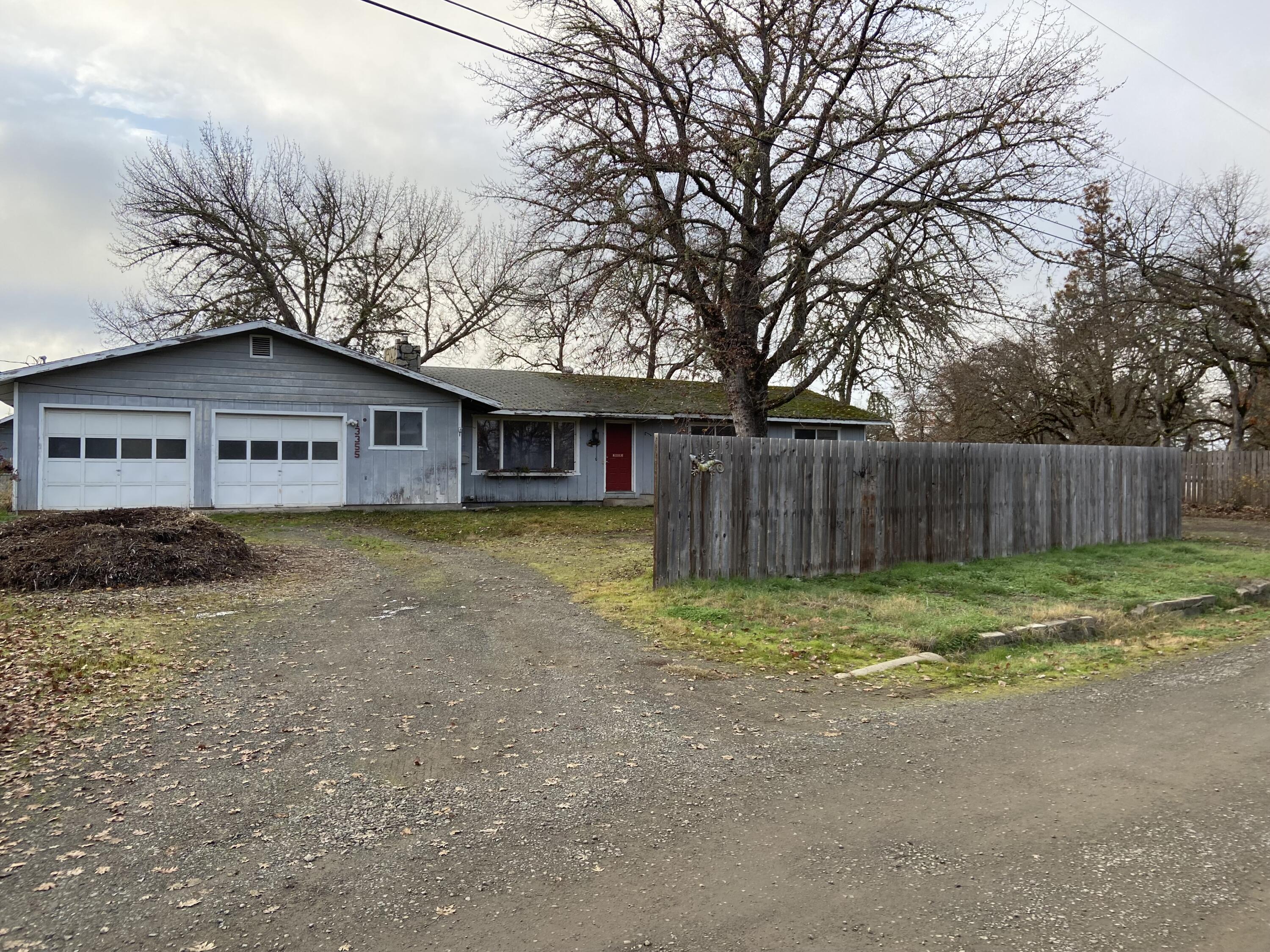 Looking for a project with plenty of potential!   This 5 acre property is conveniently located approx. 20 mintues from Medford.  3+2 stick built home on a gravel country road.  Great neighborhood. Solid home that needs TLC.  There are two shops. One is approx. 40 x 20 with slab floor and power.  The other building could be used as shop or barn. Good well per seller.  Property is nicely treed and flat ideal for horses or other farm animals.  Chicken coup with raised garden beds....overgrown but will shine once spruced up!  Would make a great family home!