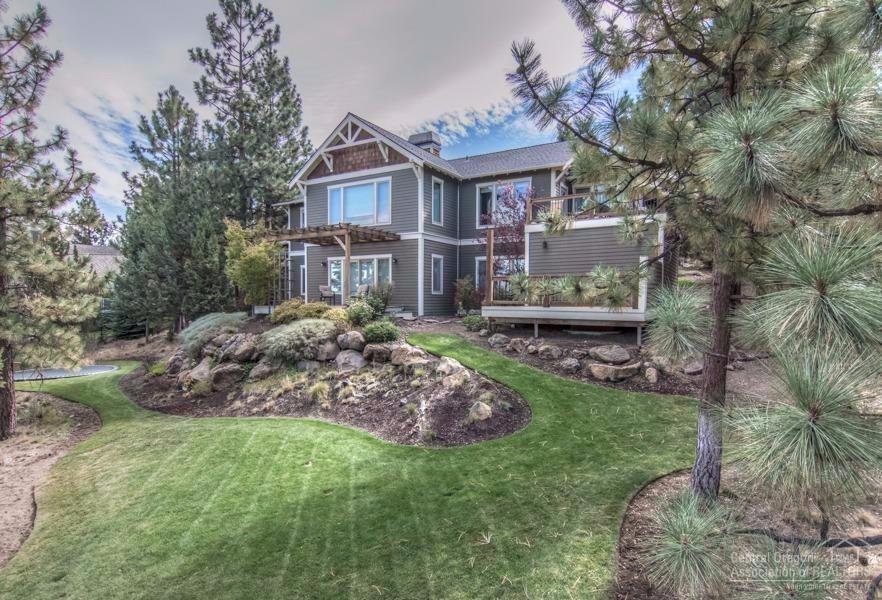 Sweeping Cascade views from Bachelor to Adams! Custom built by Craig Johannesen w/energy efficient, ICF construction. Great room features a full masonry fireplace w/wood-fired pizza oven. Extensive hardwood flooring on main level. Large kitchen offers gorgeous slab granite, high-end appliances, custom cherry cabinetry. Office/den adjacent to kitchen. Main level master suite plus a junior suite on the lower level that features a new bathroom. Oversized 3-car garage plus 2 separate, fully functional shops.