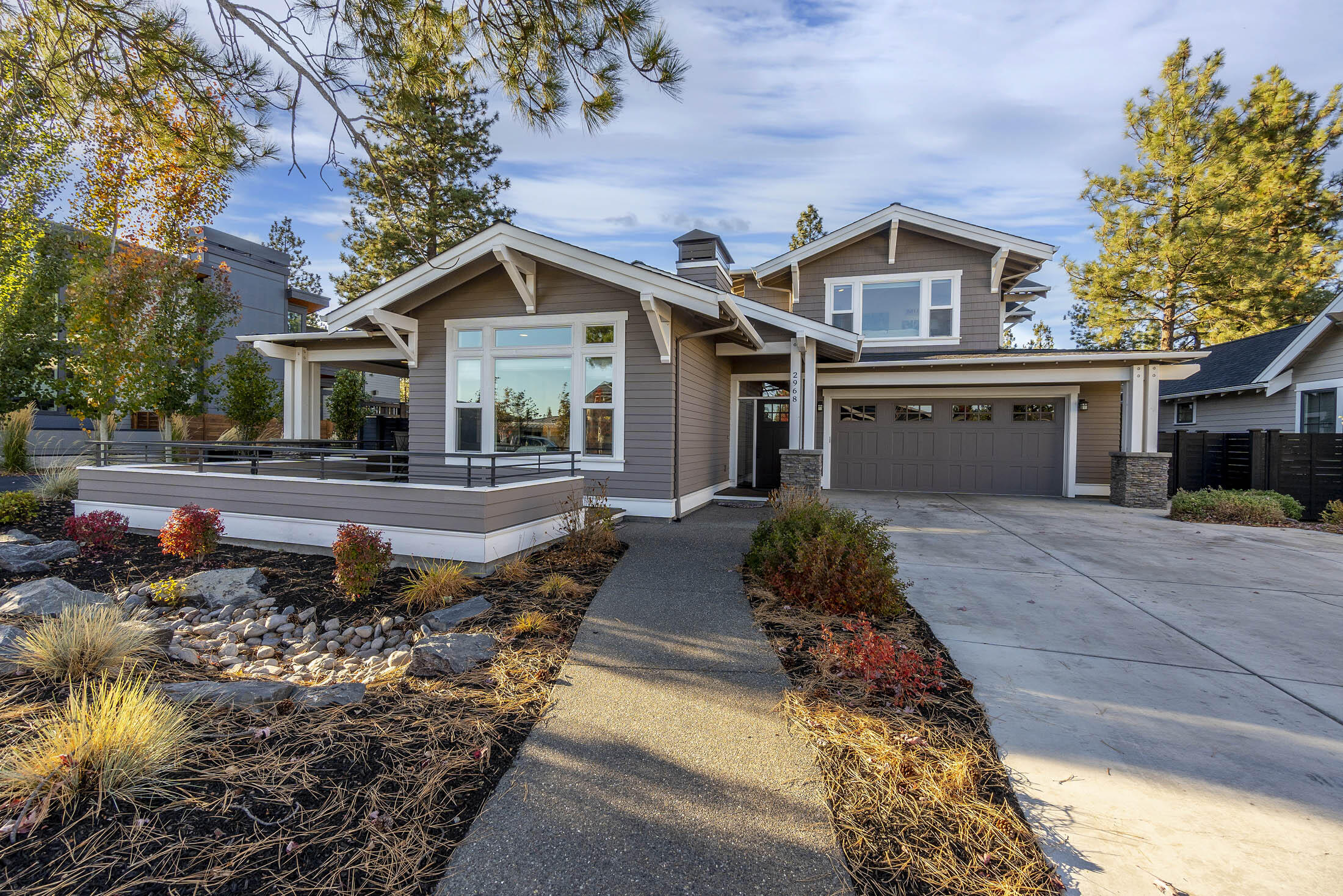 Beautifully built home by Greg Welch located in desirable Northwest Crossing feels welcoming inside and out with custom high-end finishes, open floor plan, high ceilings, lots of windows for natural light, gas fireplace, hardwood floors, quartz counter-tops, modern lighting, nicely landscaped & fenced.  Entertaining made easy with the great room & spacious kitchen with stainless steel appliances, large island & covered patios w/gas BBQ stub.  The first floor boosts the primary suite with large walk-in closet and easy access to the outdoor hot tub, two bathrooms, den, mudroom & laundry room with sink.  Relax in the soaking tub in the primary bathroom with dual vanity & spacious tiled shower. Upstairs has bonus room, desk space, two large bedrooms & full bathroom. The hot water recirculating pump makes life easier! 
Over-sized, 721 SF garage is perfect for storing all the gear with several cabinets, bike & ski racks!  Northwest Crossing has restaurants, shopping, Discovery Park & trails!