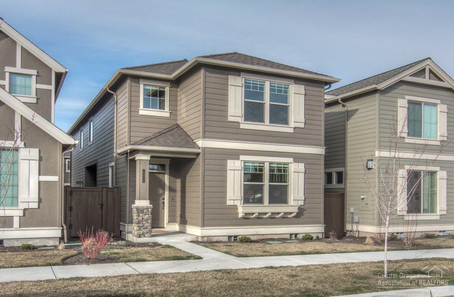 2015 Pahlisch Home Conifer Plan. Stunning home with open floor plan. Kitchen has 2 eating bars, quartz counter tops and stainless steel appliances. Great room with gas fireplace and the whole main floor has laminate wood floors. All bedrooms are upstairs. There is an open loft area perfect for office, media room or play room. Alley entrance 2 car garage. Boyd Park is in the neighborhood. HOA maintains front yard. This home has side yards on both sides of the home.