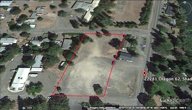 Great value on 1.29 acres of corner frontage on Highway 62 in Shady Cove. Multiple tax lots. zoned R3. Great spot for multi-family very near the river. Great visibility, two entrances, flat.