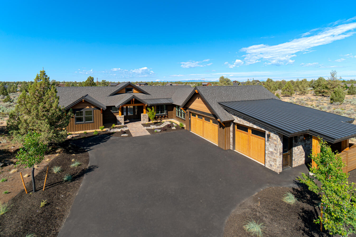Enjoy living in beautiful Powell Butte, nestled in the natural sage & bunchgrass in the heart of Central Oregon. This custom home offers rustic elegance throughout w/a grand covered entry opening to a Vaulted Great Room. Main living area ftrs rustic stone surround gas burning fireplace w/mantle. Spacious entertaining area w/coffee bar/buffet area, Gourmet kitchen & Dining space to accommodate your guests. Lg central working island, JennAir Gas cooktop w/hood, large SS refrigerator & main sink has an incredible outside view. Owner Suite separation ftrs Vaulted ceiling + slider door to back patio, bath ftrs dbl vanities, curbless tiled shower, walk in closet & builtins! A spacious office/den/workout studio is across the way w/2 junior suites w/private Baths. Oversized laundry room w/cabinetry & sink. Step outside & cozy up to the gas firepit or watch the snow fall while you bbq. As a Brasada home owner, you'll have access to an abundance of amenities for year round enjoyment.