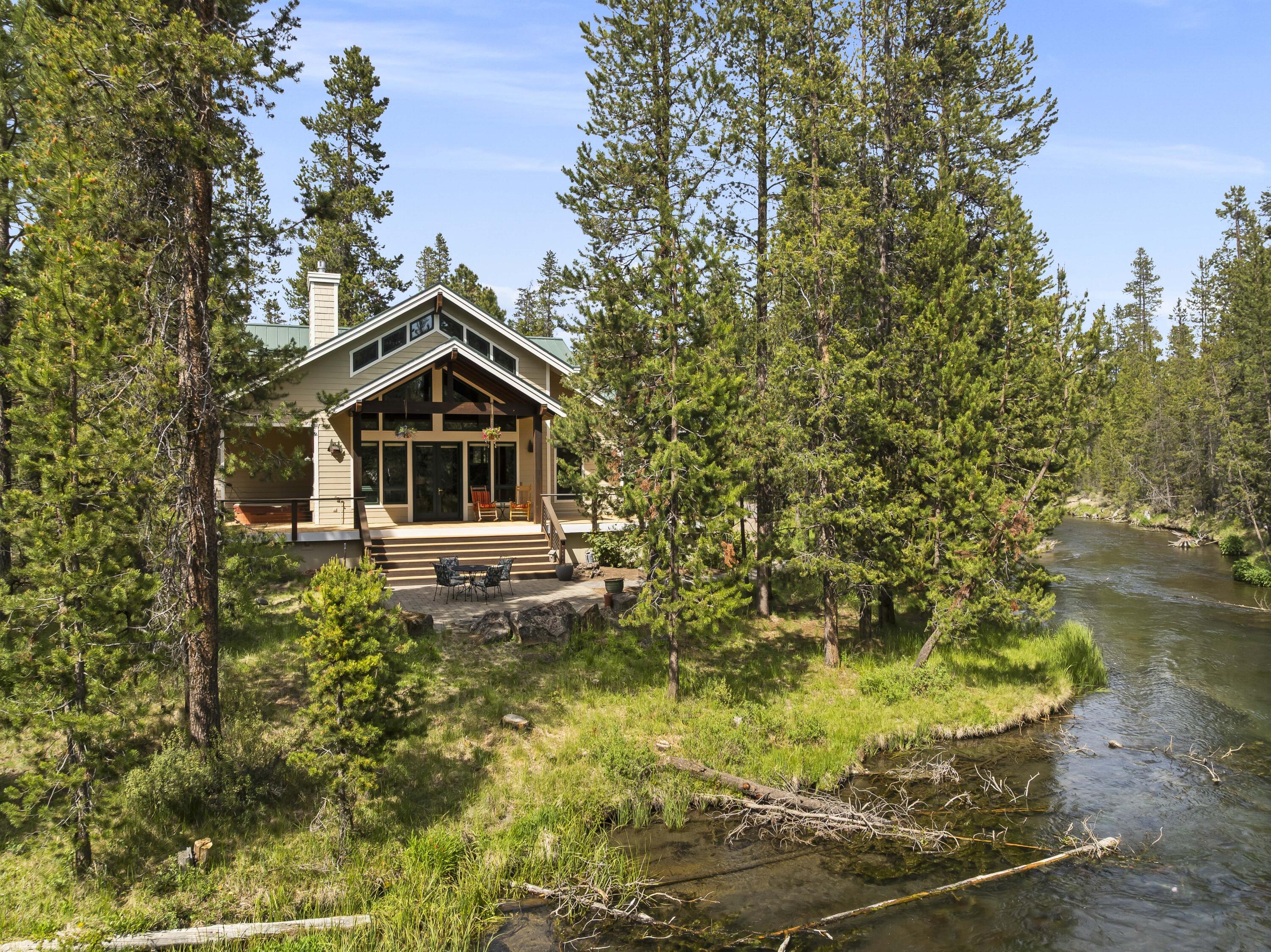 Stunning Riverfront Retreat on Fall River - 3,915 Sq Ft | 3 Bed | 4.5 Bath
Experience the ultimate in luxury and serenity with this exceptional 3,915 square foot riverfront home, nestled along over 580 feet of breathtaking panoramic Fall River frontage. This custom-designed residence perfectly blends rustic elegance and modern comfort.
3 Bedrooms, 3.5 Bathrooms - Spacious and thoughtfully designed for comfort and privacy
Expansive Outdoor Living - A huge deck, hot tub, and firepit overlook the tranquil river, ideal for entertaining or quiet evenings
Architectural Details - Soaring wood vaulted ceilings, a stunning river rock gas fireplace, and abundant natural light
Gourmet Kitchen - Equipped with solid granite countertops, custom hickory cabinetry, and premium appliances
Hardwood Hickory Floors - Throughout the main living areas, offering warmth and durability
Garage Space Galore - A large RV garage with an upper-level storage area plus an additional 1 car garage