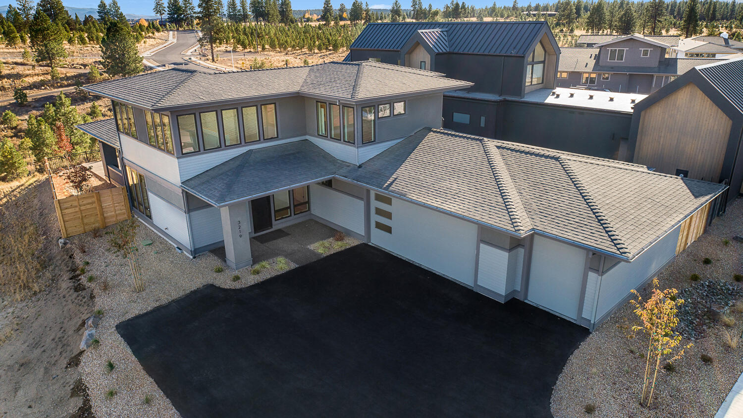 Contemporary Discovery West home built by award winning collaboration of Ollin Construction & Jason Todd Designs. Covered front porch leads to entry/great room engulfed in natural light. Kitchen features exquisite appliance package, slab quartz counters and custom built-in cabinetry with soft-close doors and drawers. Main level resident suite with tile walk-in shower, radiant heated bathroom floors and walk-in closet. Upstairs includes two guest bedrooms, full bathroom and loft area. Oversized garage with additional ''gear garage'' bay for all your requisite Central Oregon toys. Discovery West, situated on 245 acres on Bend's westside, is the newest community by the developers behind the award-winning NorthWest
Crossing neighborhood. The neighborhood will offer a variety of home types and sizes, as well as a community plaza and 40 acres of parks, trails and open land.