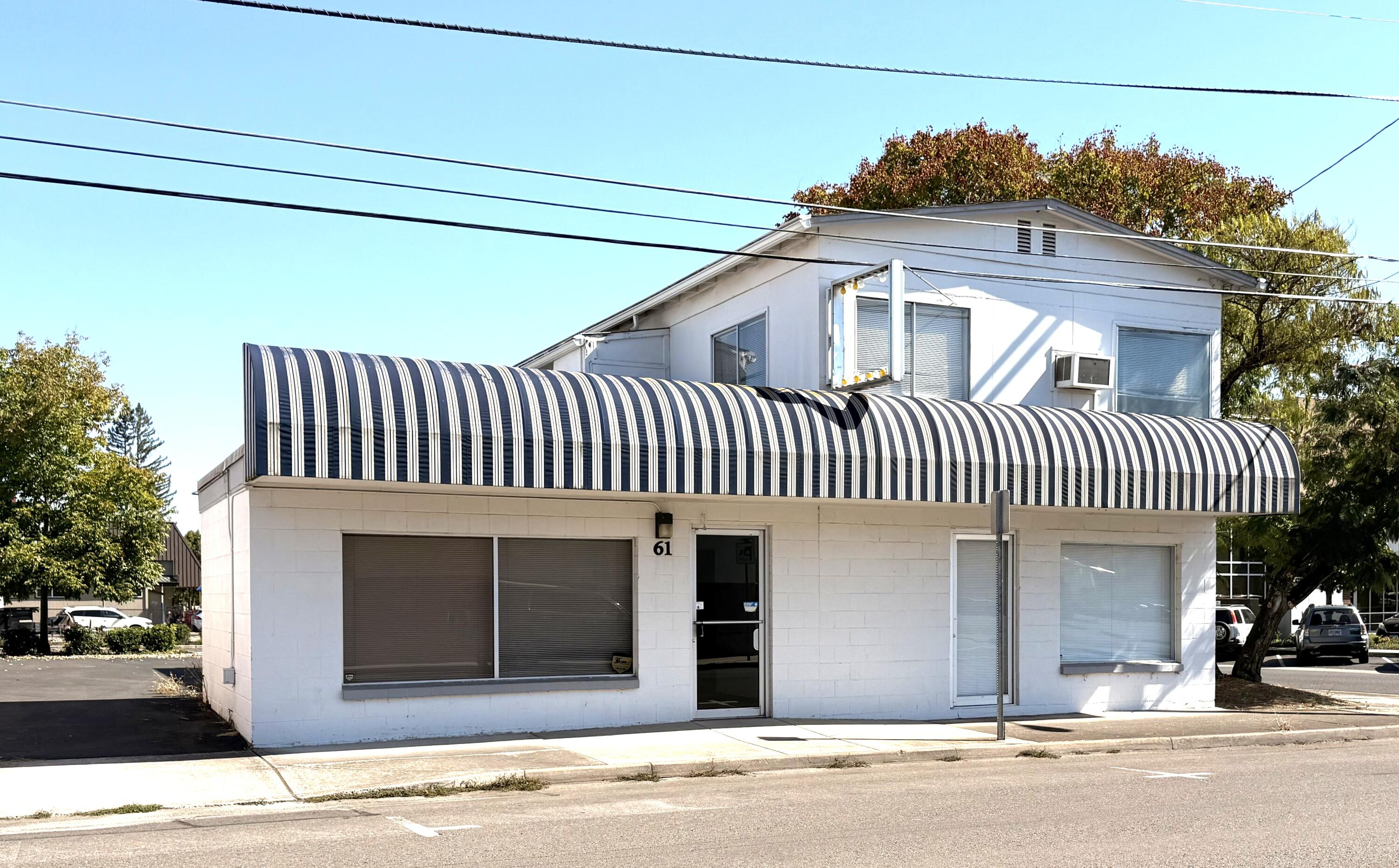 WOW, check this out, Seller is willing to owner carry for 5 years with only $50k down!! This 1,240 sq ft office space, formerly a successful tax office for years, offers great visibility and flexibility for your business needs. Plenty of parking available for clients and staff. Upstairs, a private entrance leads to a spacious 2 bed, 1 bath apartment (approx. 900 sq ft) with a full kitchen and living room, ideal for live/work or rental income. Multiple options available for configuring the space to suit your goals. Don't miss this unique opportunity!!