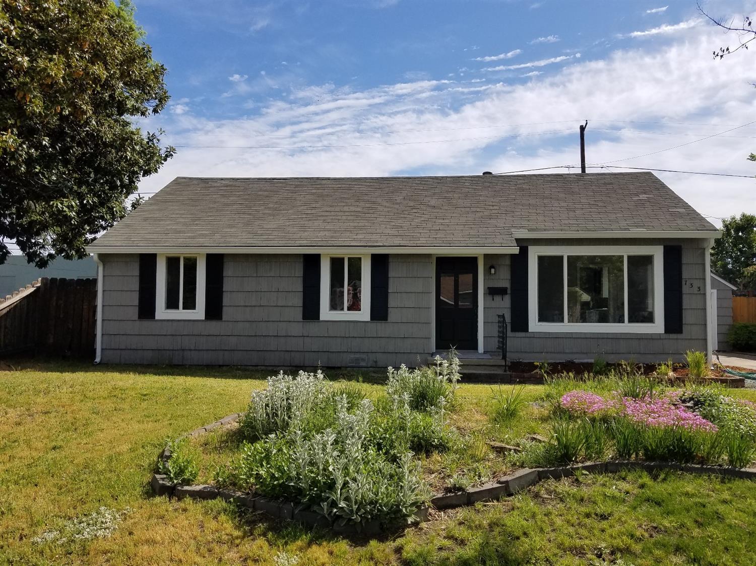 Charming 3 bd/1ba cottage on tree lined street close to parks, schools and shopping. Adorable interior with new stainless appliances, including gas range, built ins, refinished wood floors, new laminate and carpet, new paint inside and out, extra deep detached garage, great for shop or ? and large fenced backyard.