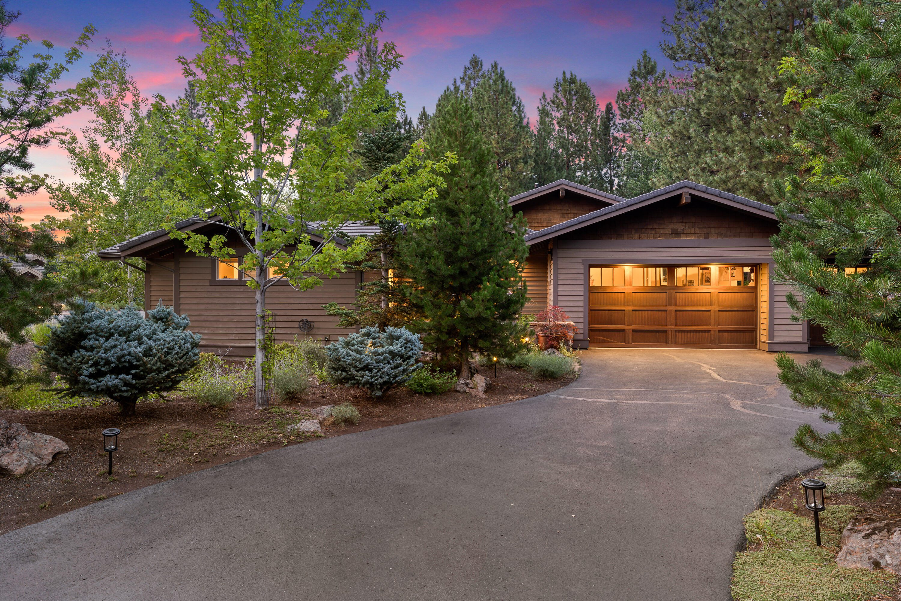Welcoming courtyard & water feature beckon you into this meticulously maintained single level home located in Broken Top. Great room concept w/large picture windows & built-in media cabinet w/gas fireplace. Open kitchen w/built-in breakfast nook, massive breakfast bar/island ideal for entertaining & meal prep. Other features include slab granite counter tops, hardwood floors, Sapele wood cabinets w/soft close drawers & full house hot water re-circulation system. Private Primary Suite with separate heating zone & heated bathroom floors. Two additional bedroom suites in separate wing offers ideal separation.  The den/bonus room with doors is the perfect spot for kids, exercise studio or home office. Relax and entertain with your choice of two patio spaces, one off the kitchen area, the other off the great room. This home also boasts Hunter Douglas Duette top-down/bottom-up blinds, Chamberlain garage door opener, Honeywell thermostats and Orbit irrigation controller are internet-enabled.