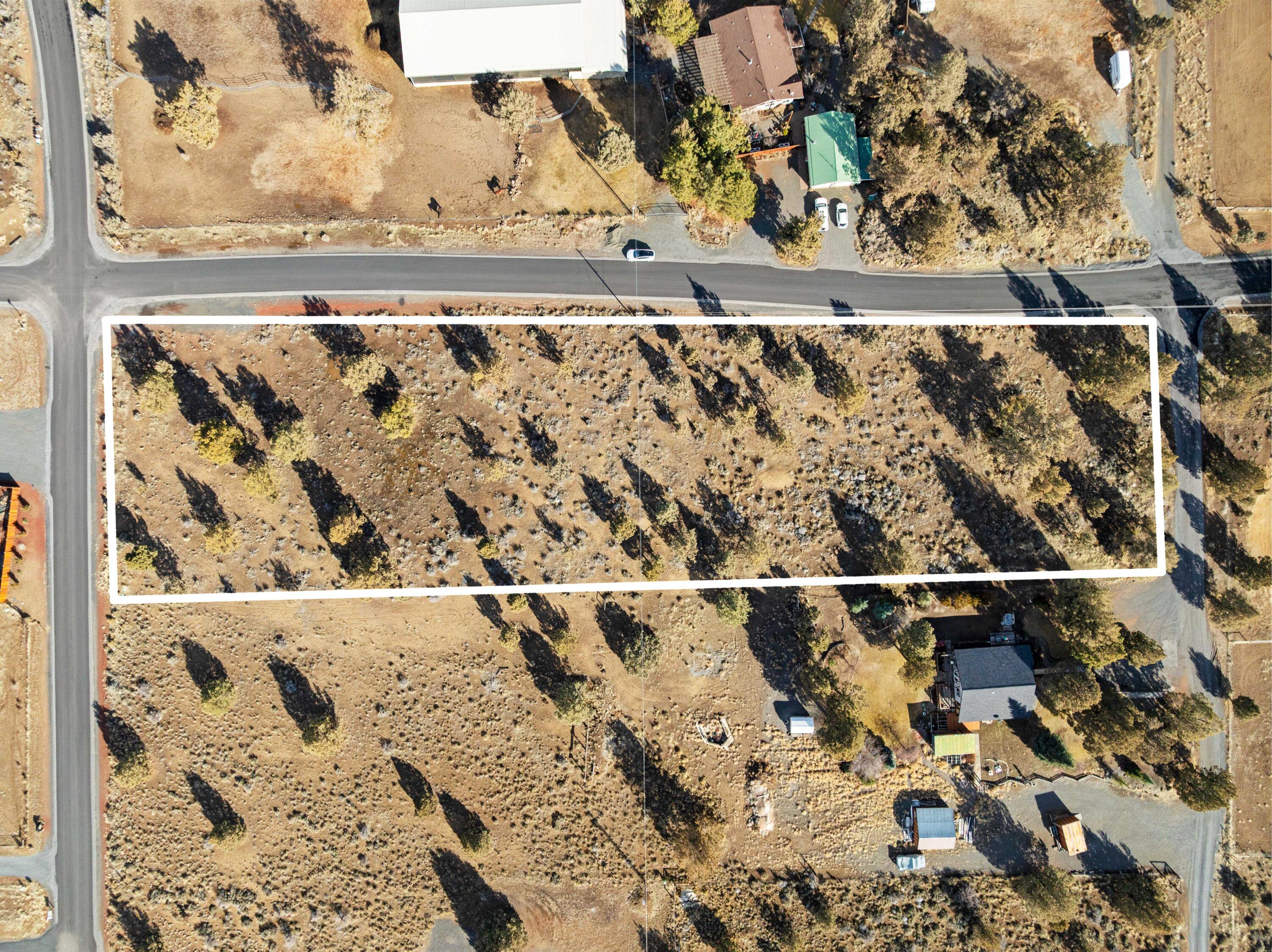 Stunning Cascade Mountain views from this beautifully treed, 2.16 acre lot, located in the Sisters school district! Sun Mtn Water hookup fees are paid, Central Electric power is at the property line and roads are paved. Perfect central location between Bend and Sisters. No CC&Rs or HOA in this well established rural neighborhood. This is an ideal lot, ready to build your dream home! Quick and easy access to the BLM Fryrear Trailhead (2 miles North) and various locations within the Deschutes National Forest are just a few miles away. Bring your idea and toys and make this property home!