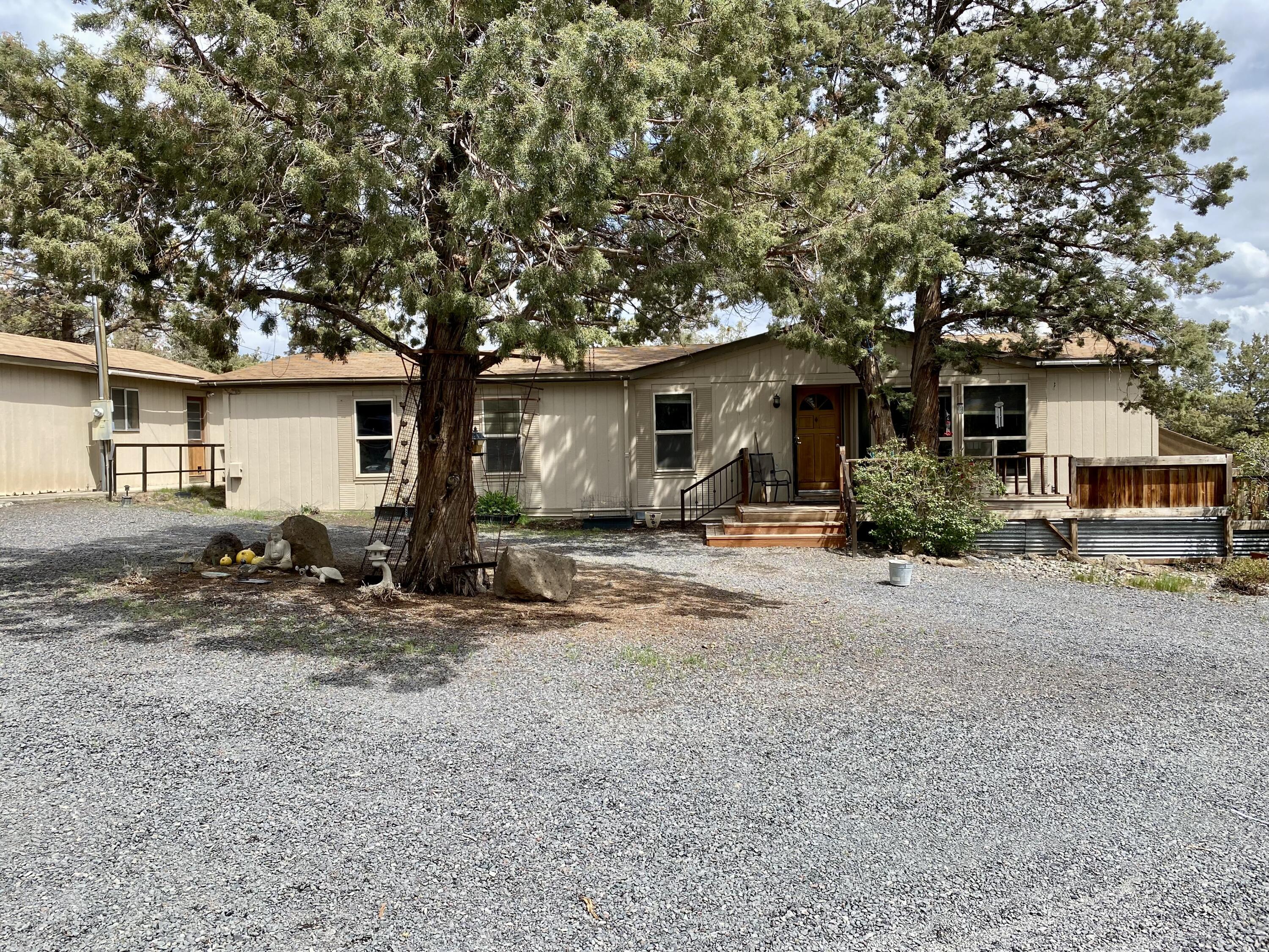 Nestled within the picturesque Whispering Pines Subdivision lies a peaceful 2.47-acre property that offers the perfect blend of convenience and seclusion. Boasting a 3-bedroom, 2-bathroom 1,512 sq ft manufactured home on level land just waiting for your personal touches. This property provides a peaceful and serene setting to call home. The large 2,400 sq ft pole barn built in 2007 (measuring 40x60) provides ample space for all your storage and workspace needs. Additionally, the property is fully fenced and features a detached 20x20 garage, perfect for tinkering with your hobbies or protecting your vehicles from the elements. Don't miss out on this incredible opportunity to experience the ultimate Oregon lifestyle.