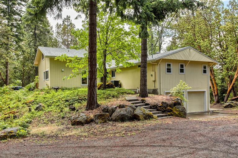 Over 40 Acres of beautifully wooded land with a well cared for home of over 2000 sq ft that has had many upgrades in recent years. This secluded and private mountain property is the perfect getaway for simple quiet living and is located less than ten miles from Ashland and approximately 12 miles from Howard Prairie Lake. This property also has another house site with the potential of building another separate dwelling where there are currently two existing outbuildings. Purchase this property along with the adjacent property located at 9069 Dead Indian Memorial Rd that is also for sale for the perfect family compound totaling over 120 acres and four separate residences with the potential for more.