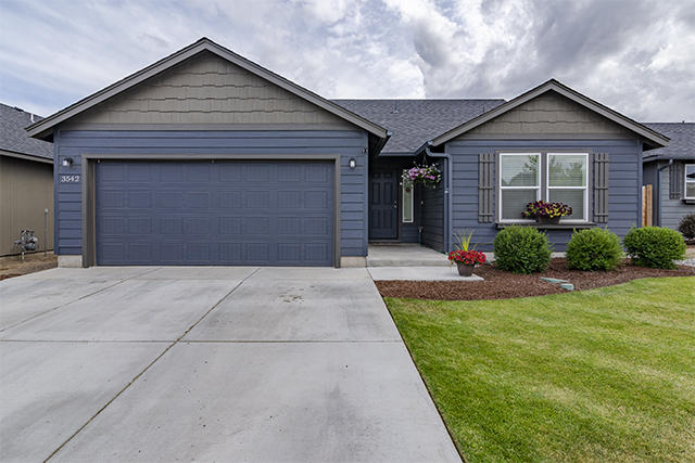 Immaculate like new home in desirable southwest Redmond location, within walking distance of Hayden Park.  This home is a one level with 1408 sqft, and features 3 bedrooms and 2 bathrooms, a laundry room, and A/C.  It has a fully fenced backyard and an oversized garage that will fit a full size truck with 220V outlet!  Inside has vaulted ceilings in the open concept great room, a vaulted master bedroom with his & hers closets.  Schedule a preview of this lovely home today!