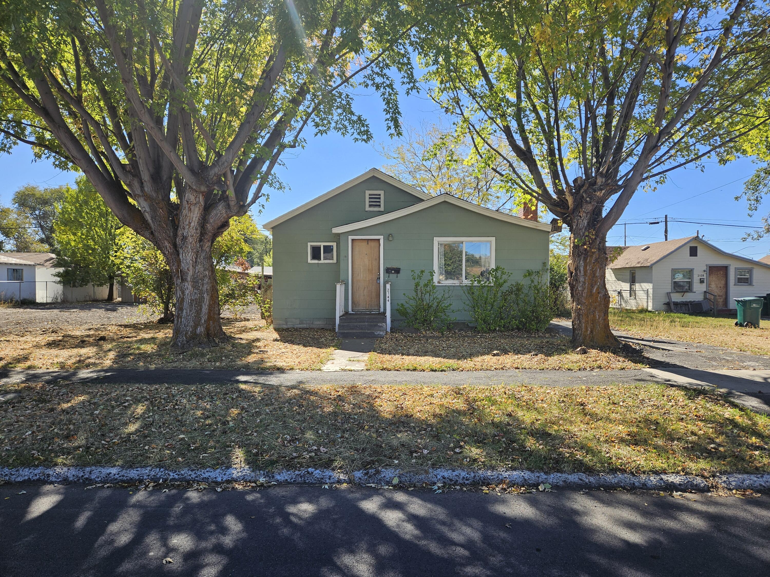Well-priced fixer upper! Perfectly sized home w/spacious yard. Would make a cute rental or personal residence. Well laid out with sizable rooms- most with multiple windows. Two bedrooms, one bathroom, and separate office room off of master w/exterior access. Spacious and level backyard with fruit trees and alley behind. Room to add garage/shop. New roof installed end of October 2025. Sold as-is and priced to reflect condition. Buyer to do due diligence on all property details, lot uses, and development potential.